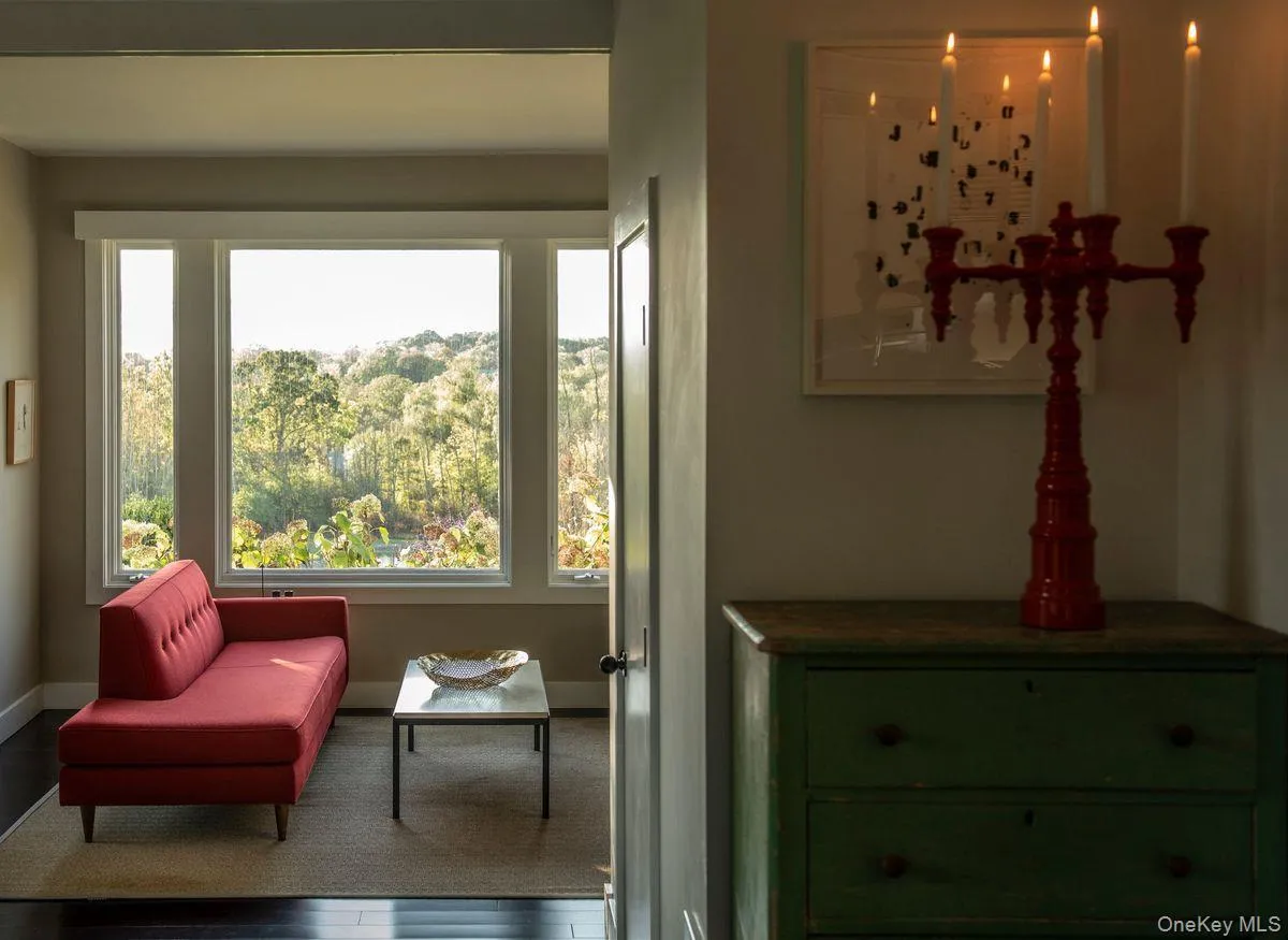 Sitting room featuring wood finished floors and baseboards Sitting room featuring wood finished floors and baseboards