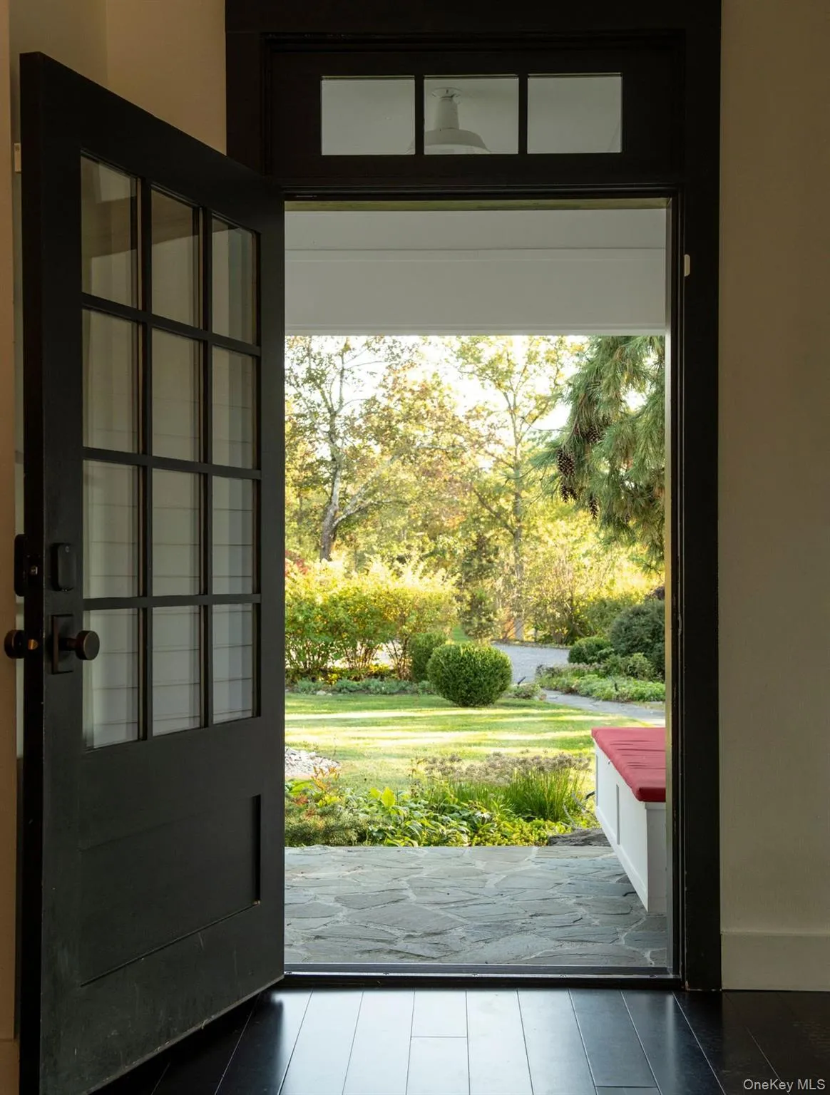 Doorway featuring tile patterned flooring and healthy amount of natural light Doorway featuring tile patterned flooring and healthy amount of natural light