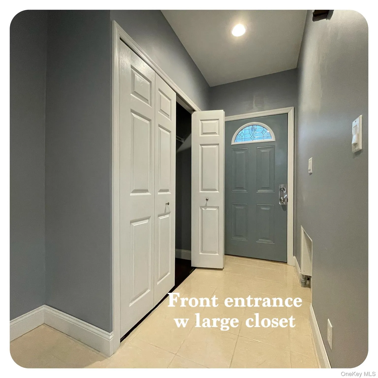 Foyer entrance with baseboards and light tile patterned floors Foyer entrance with baseboards and light tile patterned floors