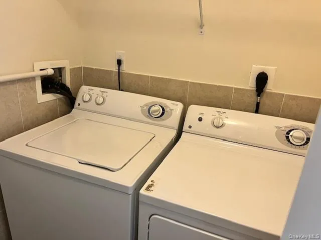 Laundry area featuring washing machine and dryer Laundry area featuring washing machine and dryer
