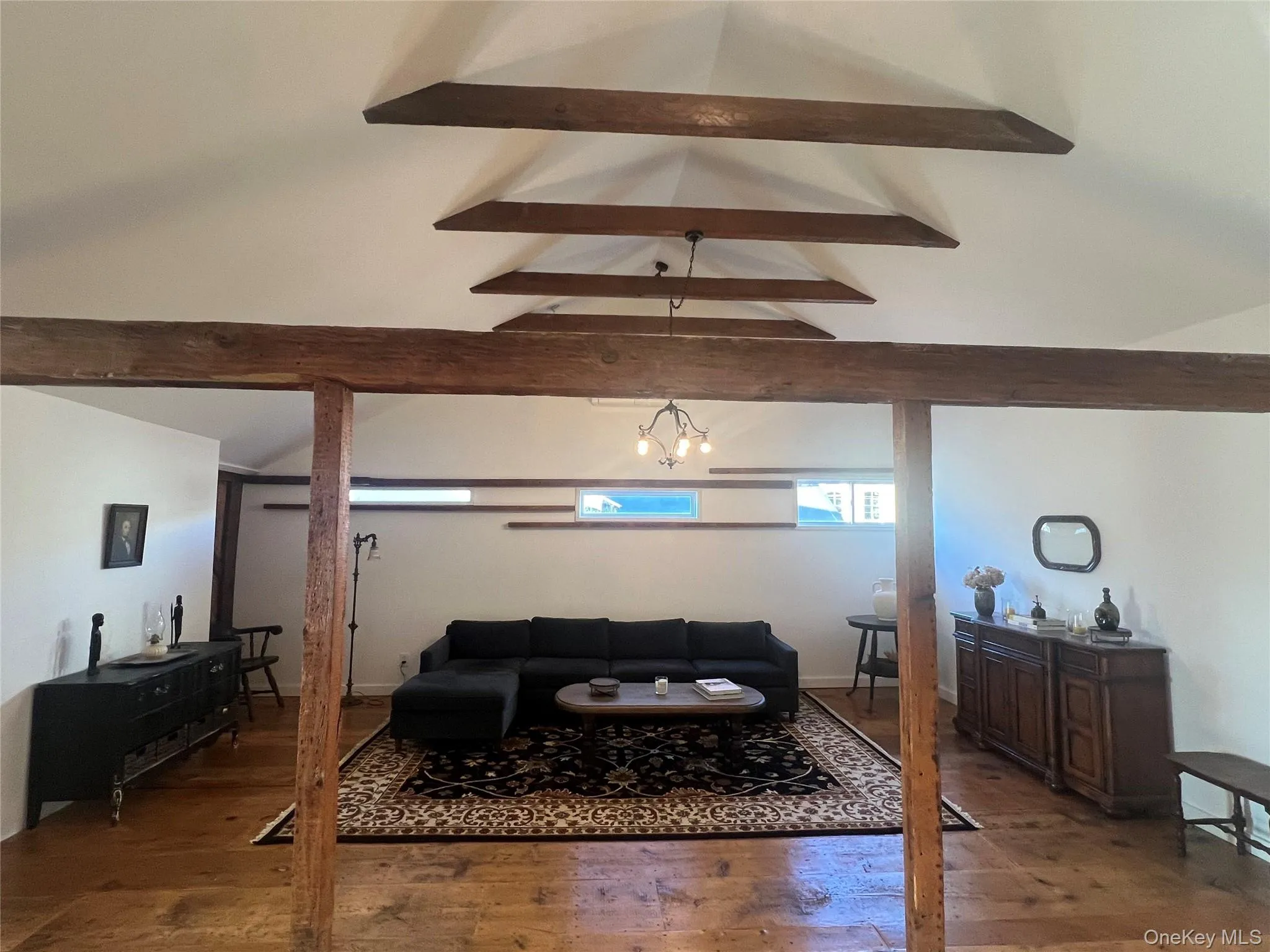 Living area featuring hardwood flooring Living area featuring hardwood flooring