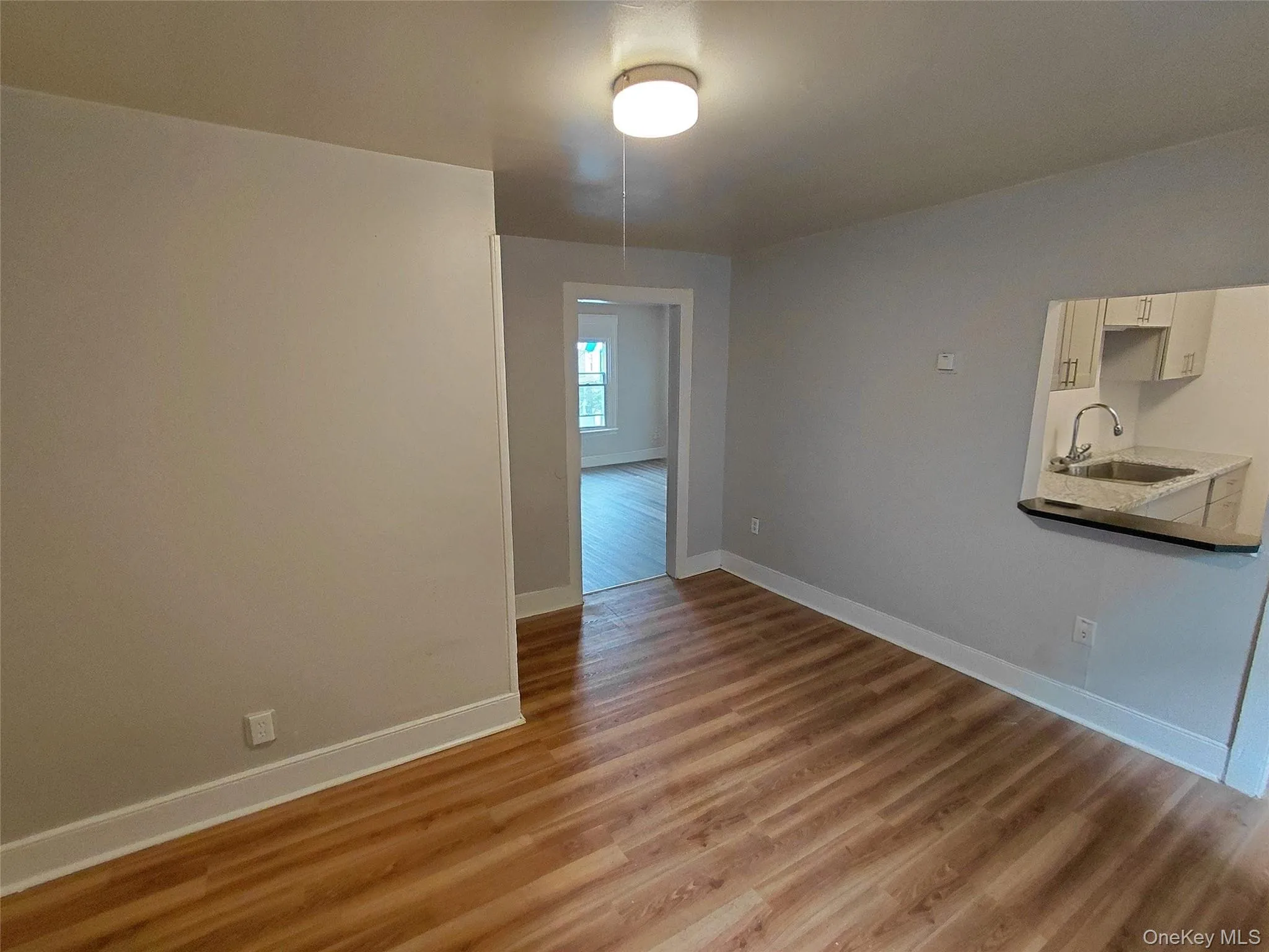 Unfurnished dining area featuring light wood-style floors Unfurnished dining area featuring light wood-style floors