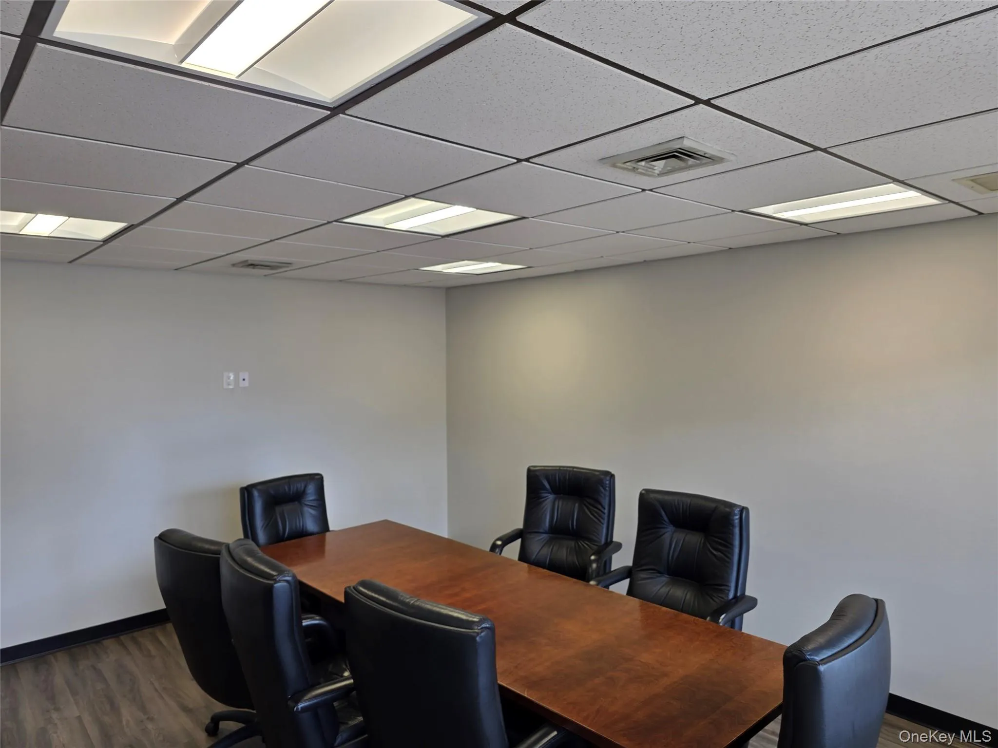 Office space featuring a paneled ceiling Office space featuring a paneled ceiling