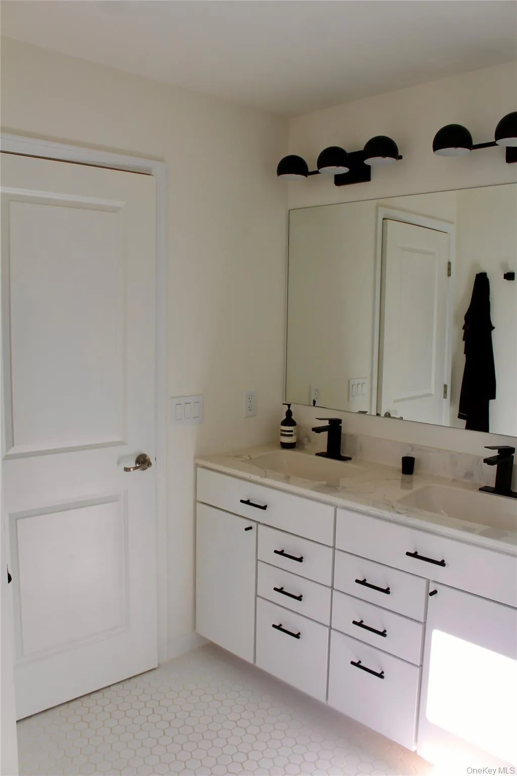 Bathroom featuring double vanity Bathroom featuring double vanity