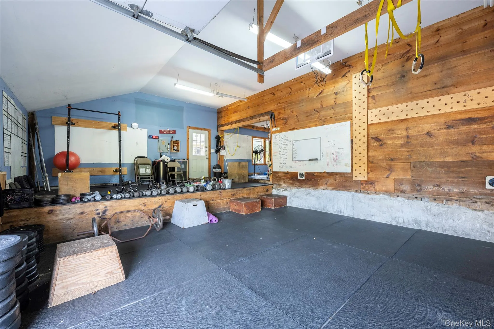 Garage featuring wooden walls Garage featuring wooden walls