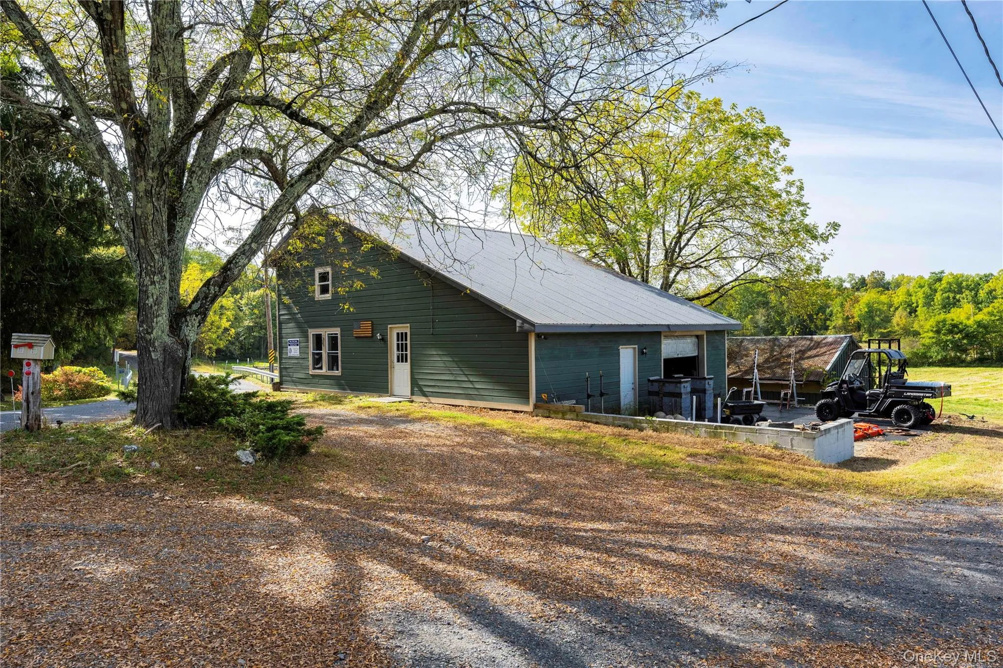 View of home's exterior featuring a metal roof View of home's exterior featuring a metal roof