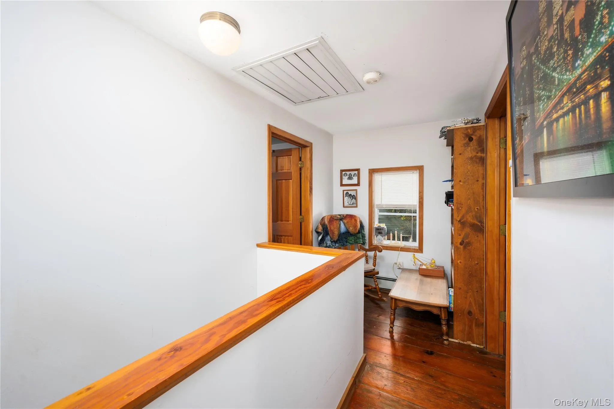 Hall featuring dark wood-style floors Hall featuring dark wood-style floors