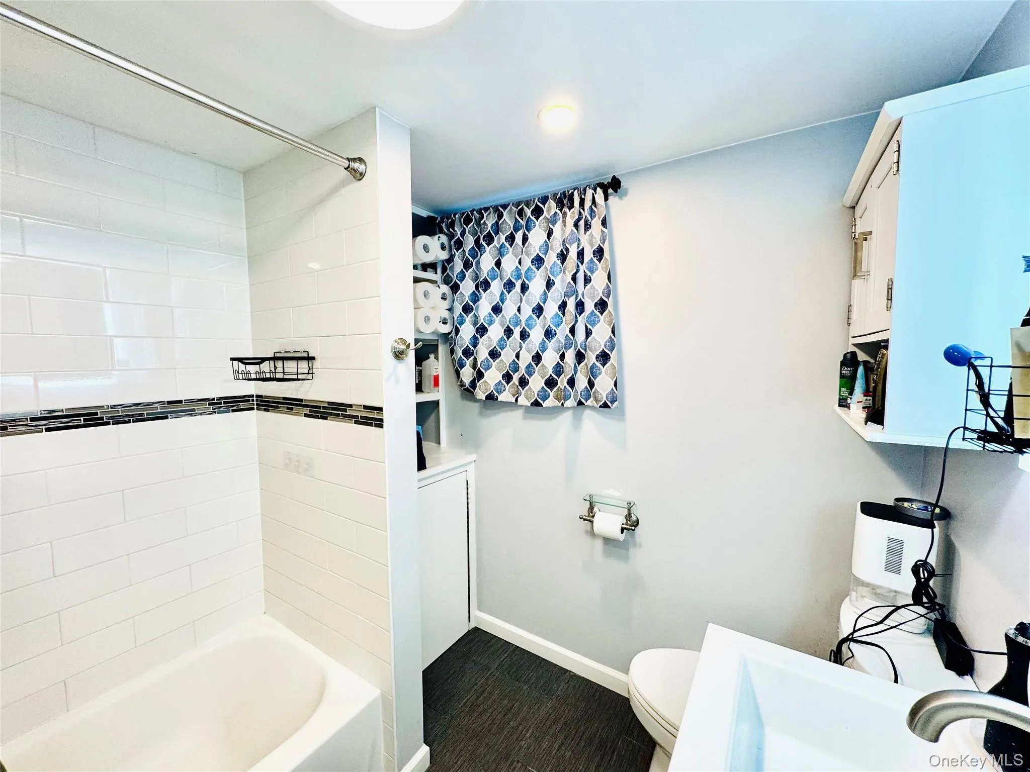 Full bathroom with shower / tub combination and toilet Full bathroom with shower / tub combination and toilet
