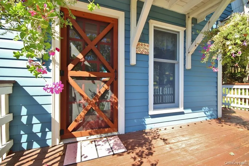 Property entrance featuring a deck Property entrance featuring a deck