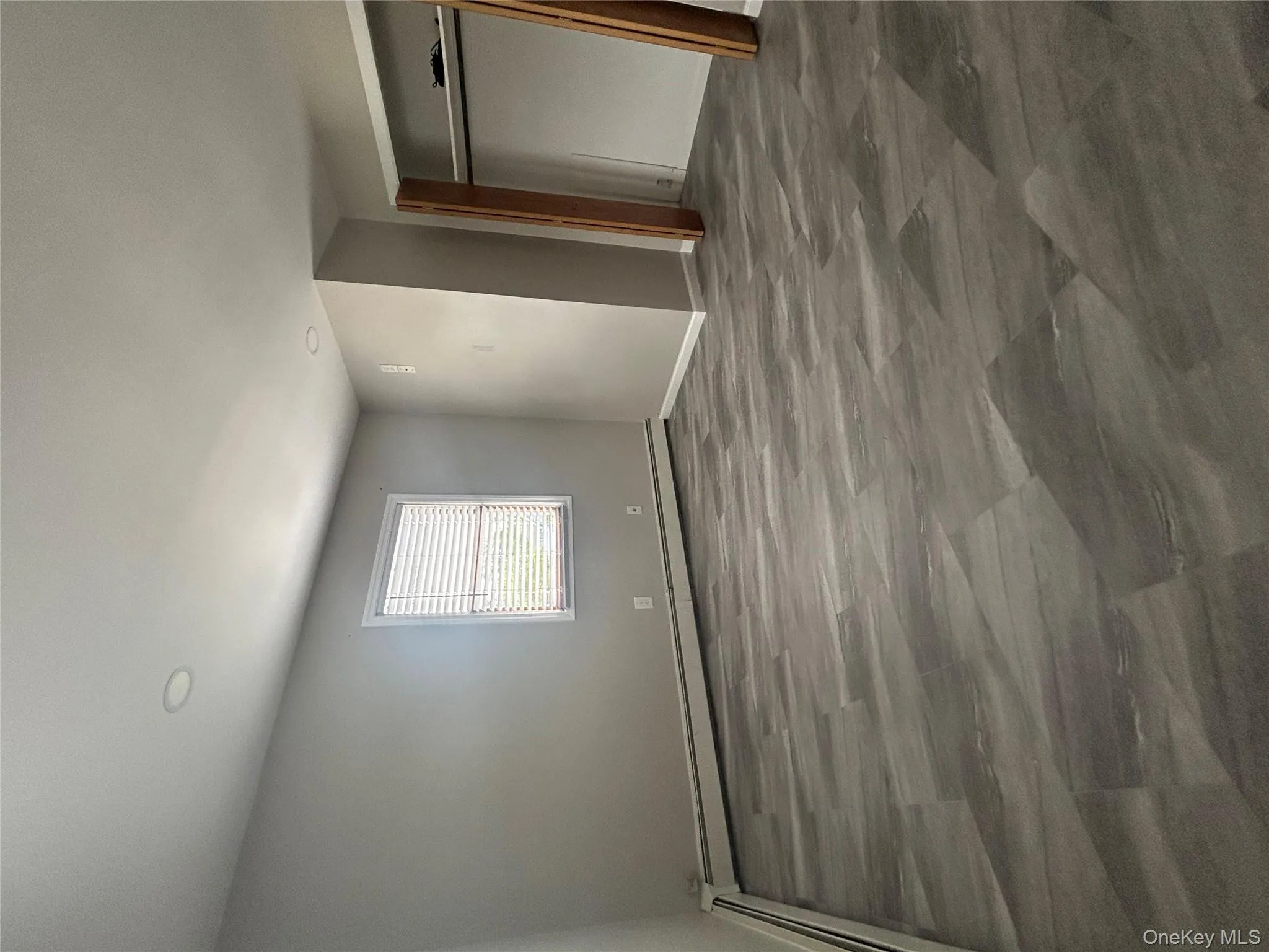 Unfurnished bedroom featuring baseboard heating, a closet, and recessed lighting Unfurnished bedroom featuring baseboard heating, a closet, and recessed lighting