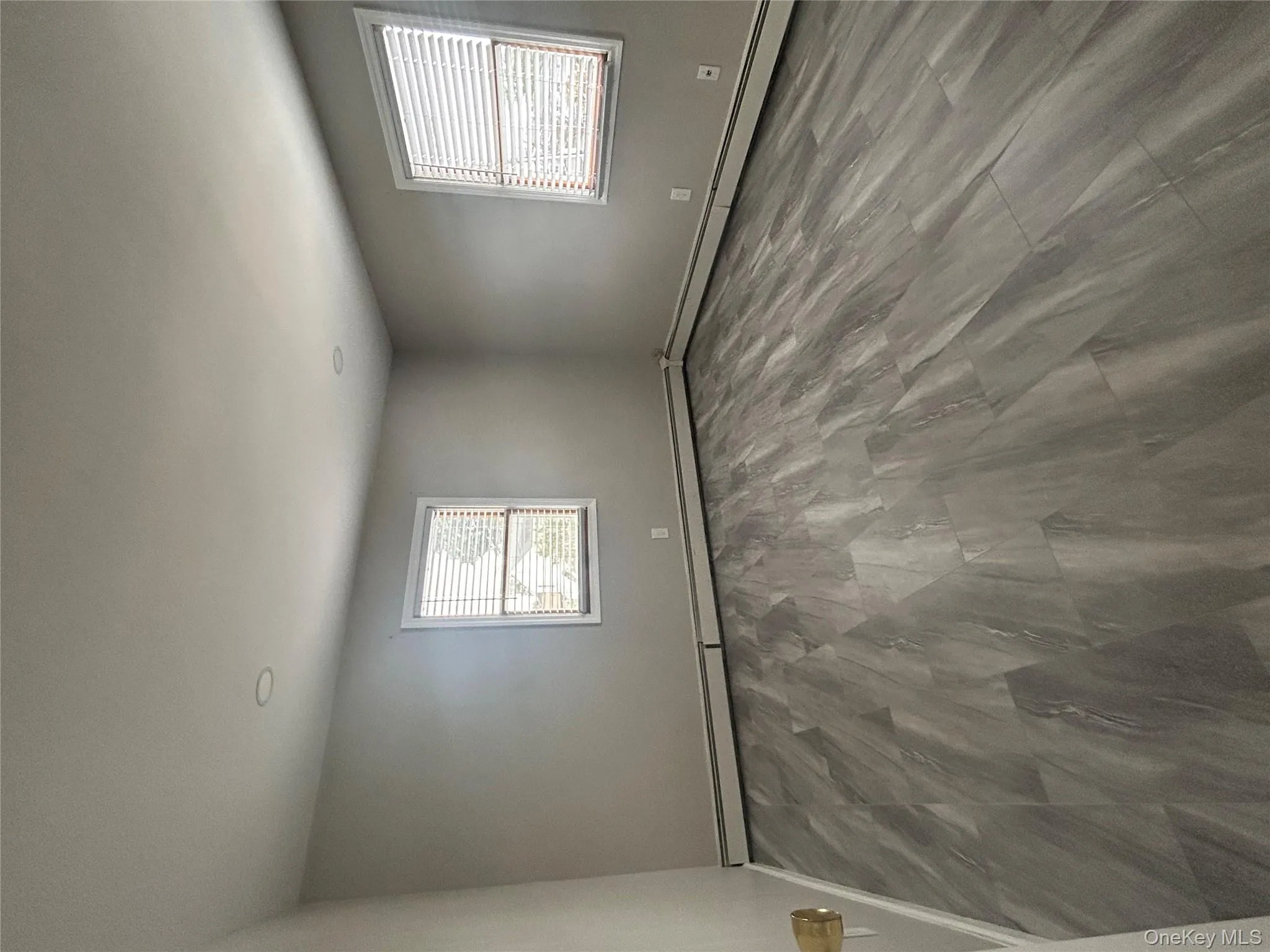 Spare room featuring baseboard heating and baseboards Spare room featuring baseboard heating and baseboards