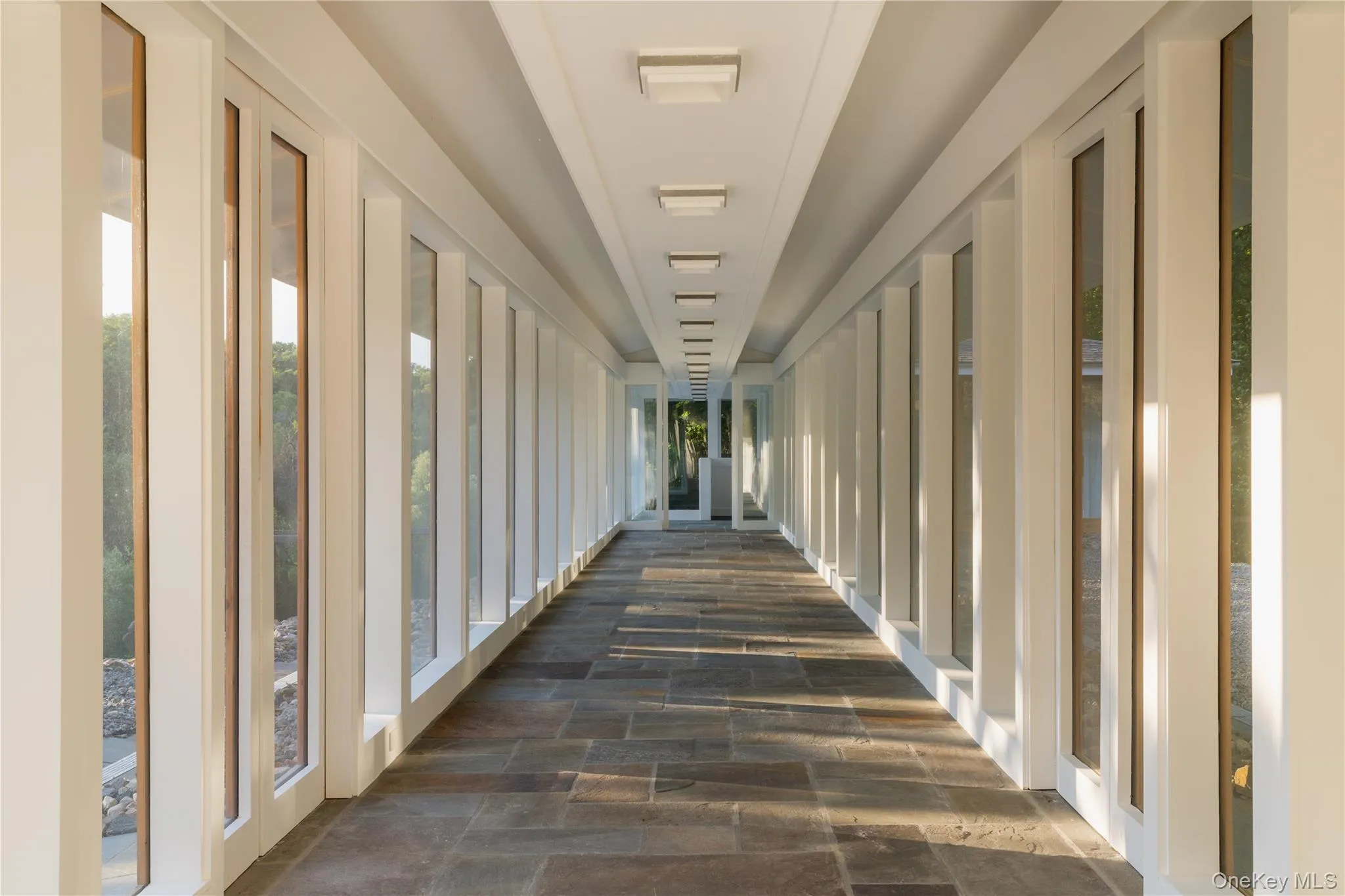 Glass enclosed corridor linking the suites in the Guest Pavilion Glass enclosed corridor linking the suites in the Guest Pavilion