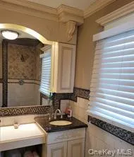 Bathroom with vanity and ornamental molding Bathroom with vanity and ornamental molding