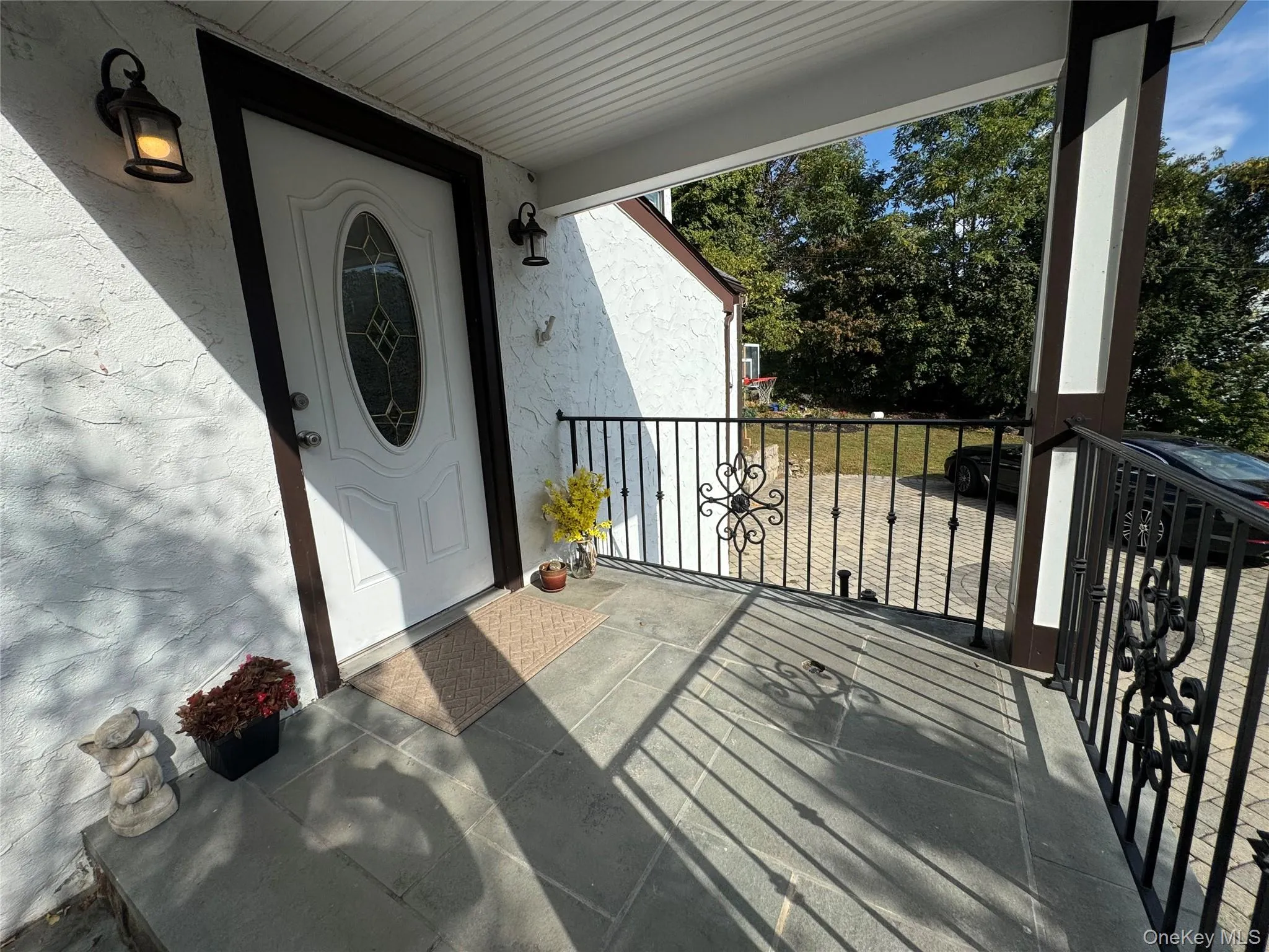 Entrance to property with stucco siding Entrance to property with stucco siding