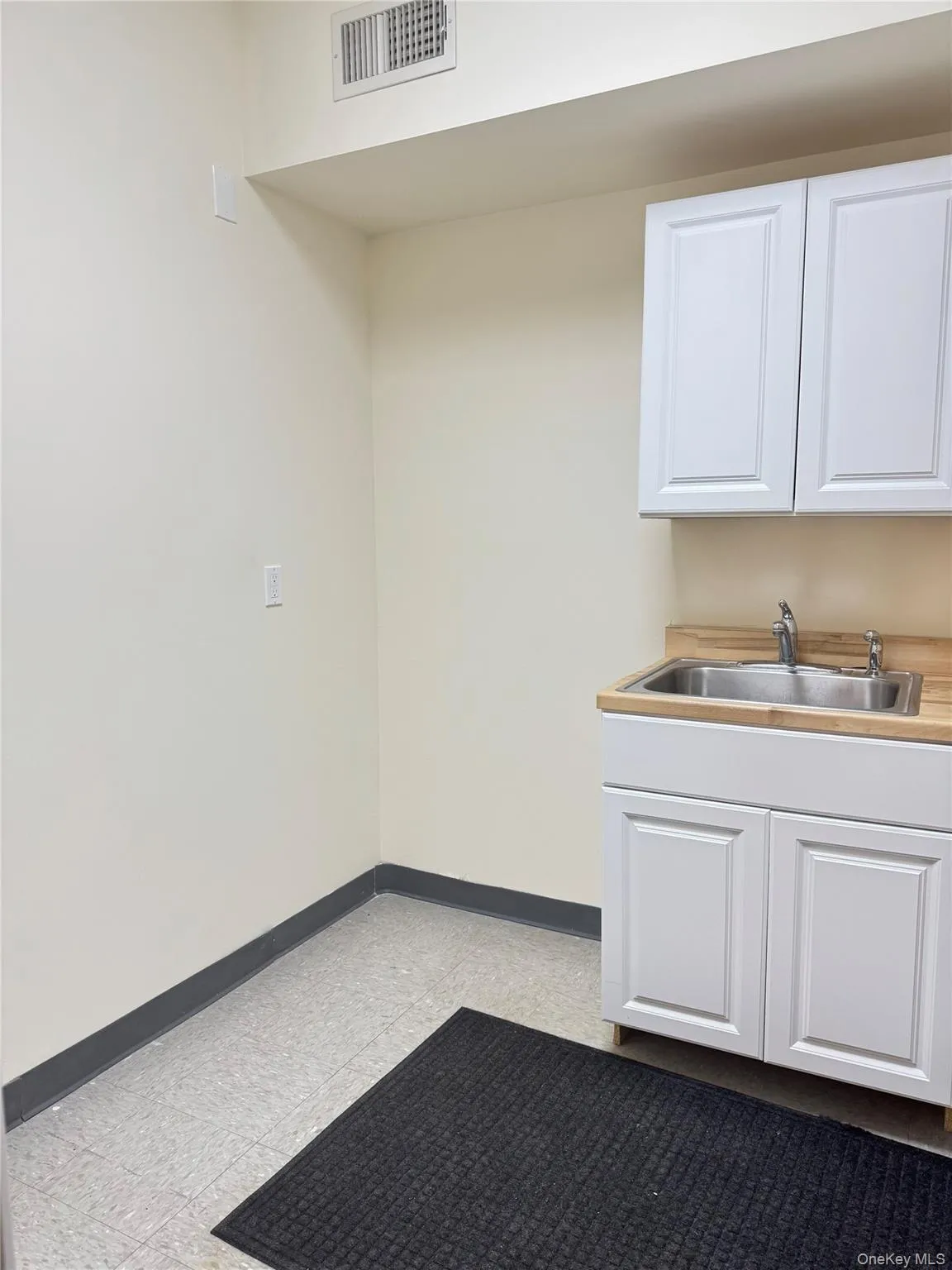 Kitchen with white cabinets and light countertops Kitchen with white cabinets and light countertops