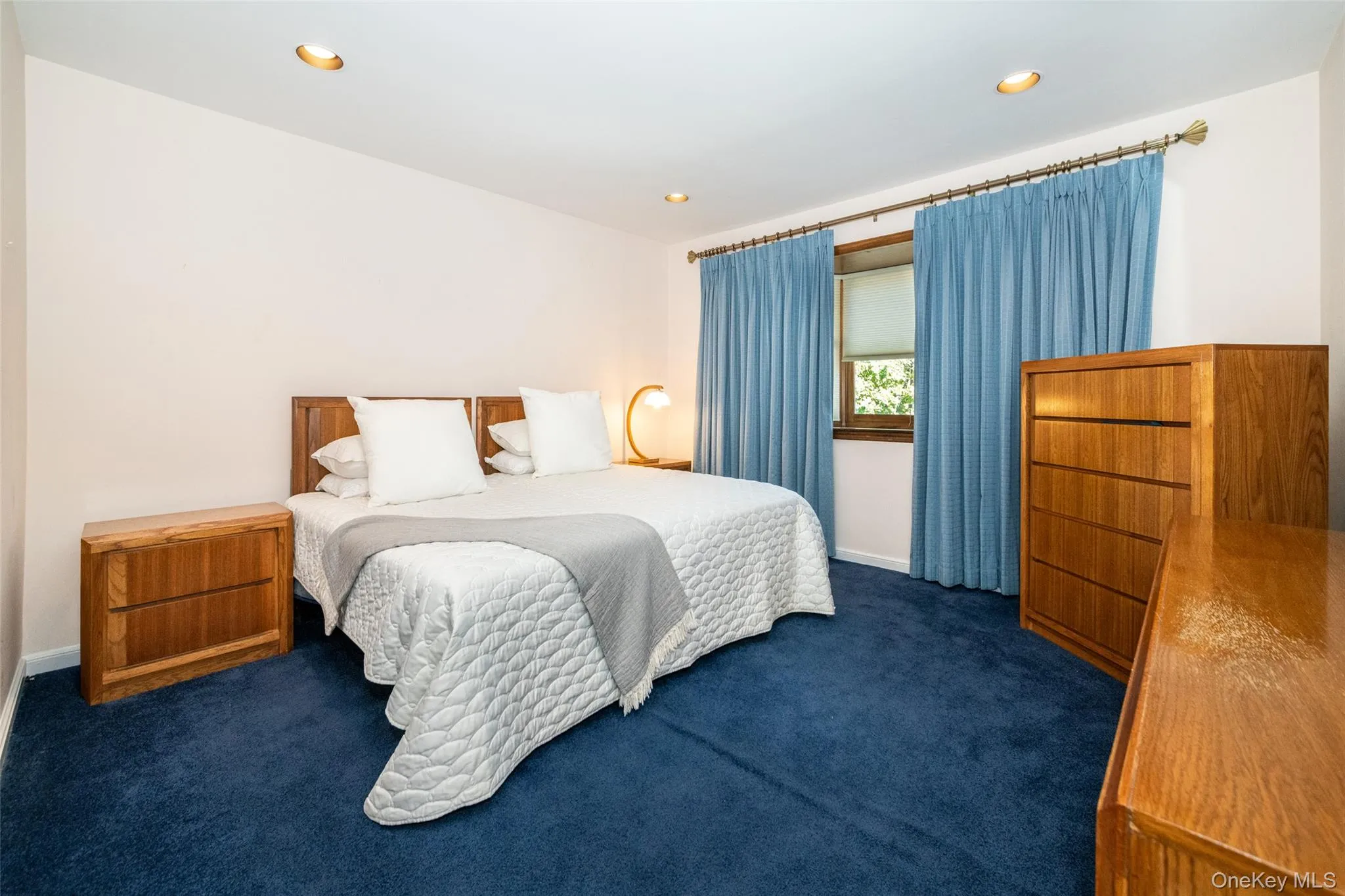 Bedroom with recessed lighting and carpet flooring Bedroom with recessed lighting and carpet flooring