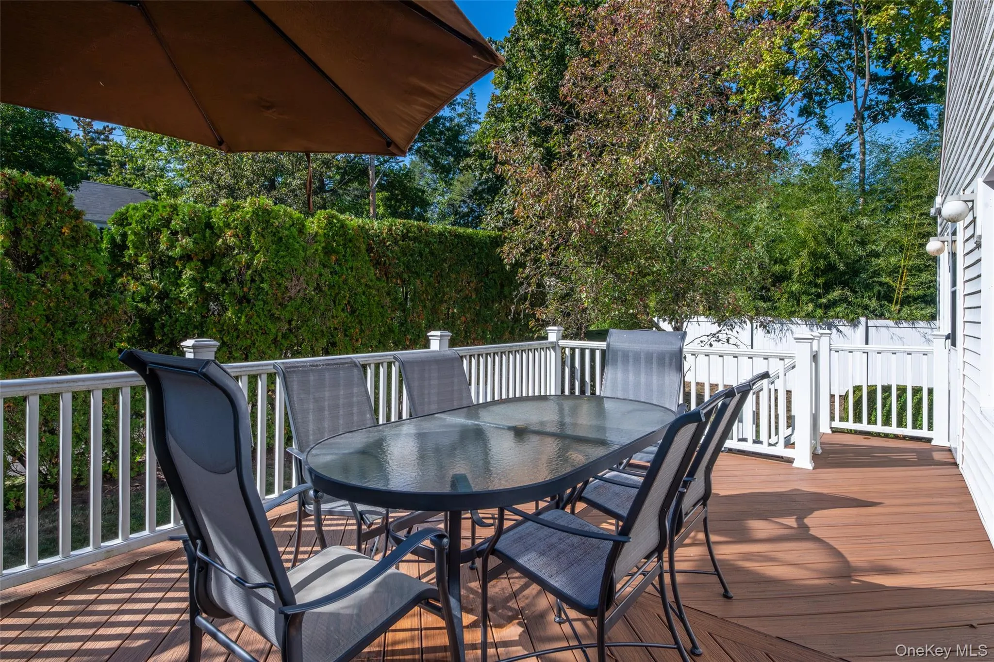 Wooden deck with outdoor dining area Wooden deck with outdoor dining area