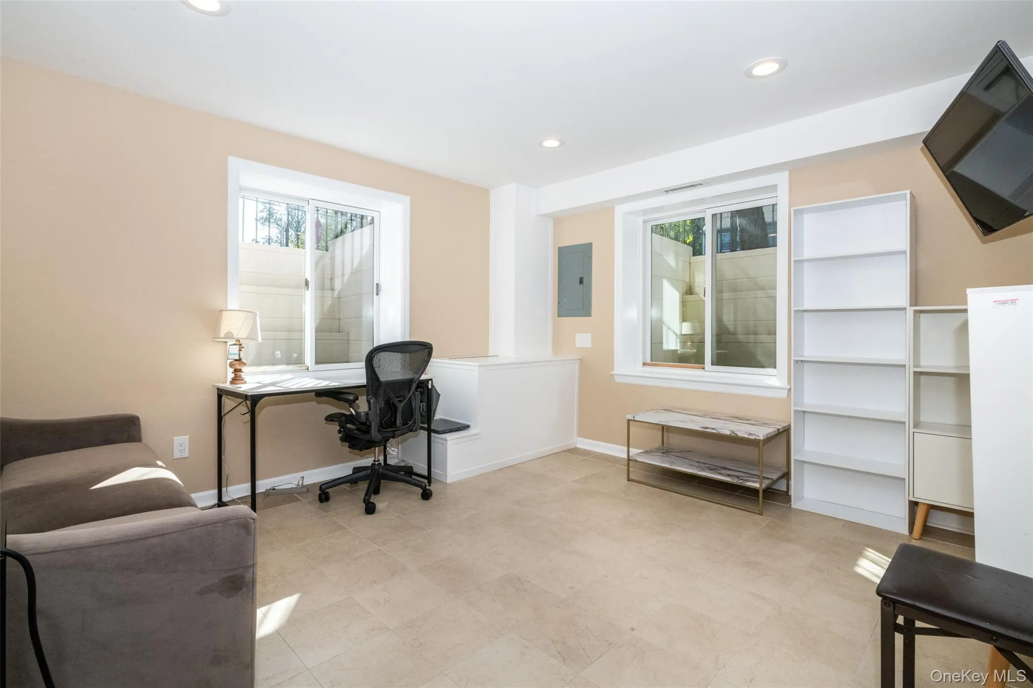 Office area featuring recessed lighting and electric panel Office area featuring recessed lighting and electric panel