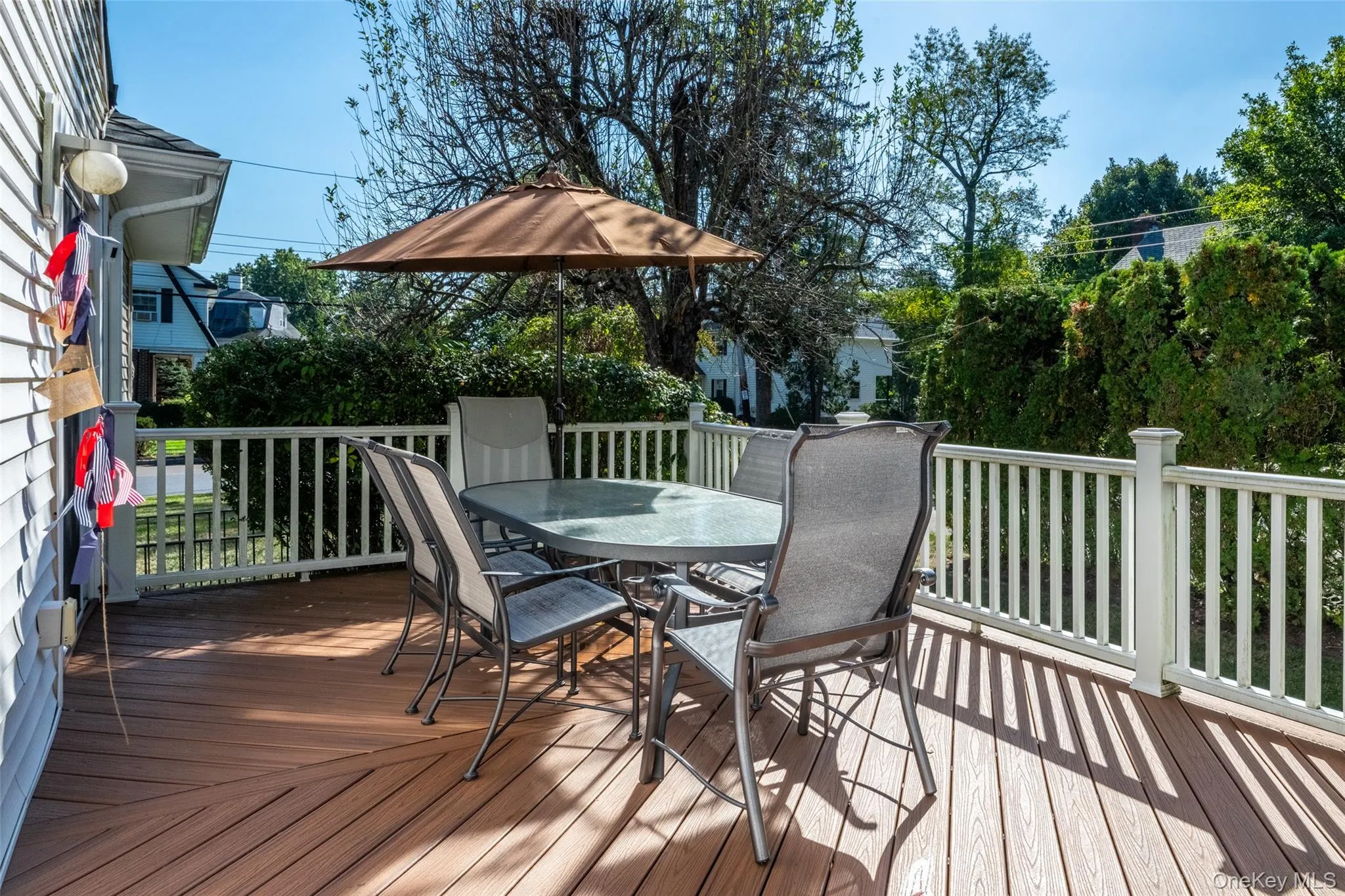 Wooden deck with outdoor dining area Wooden deck with outdoor dining area