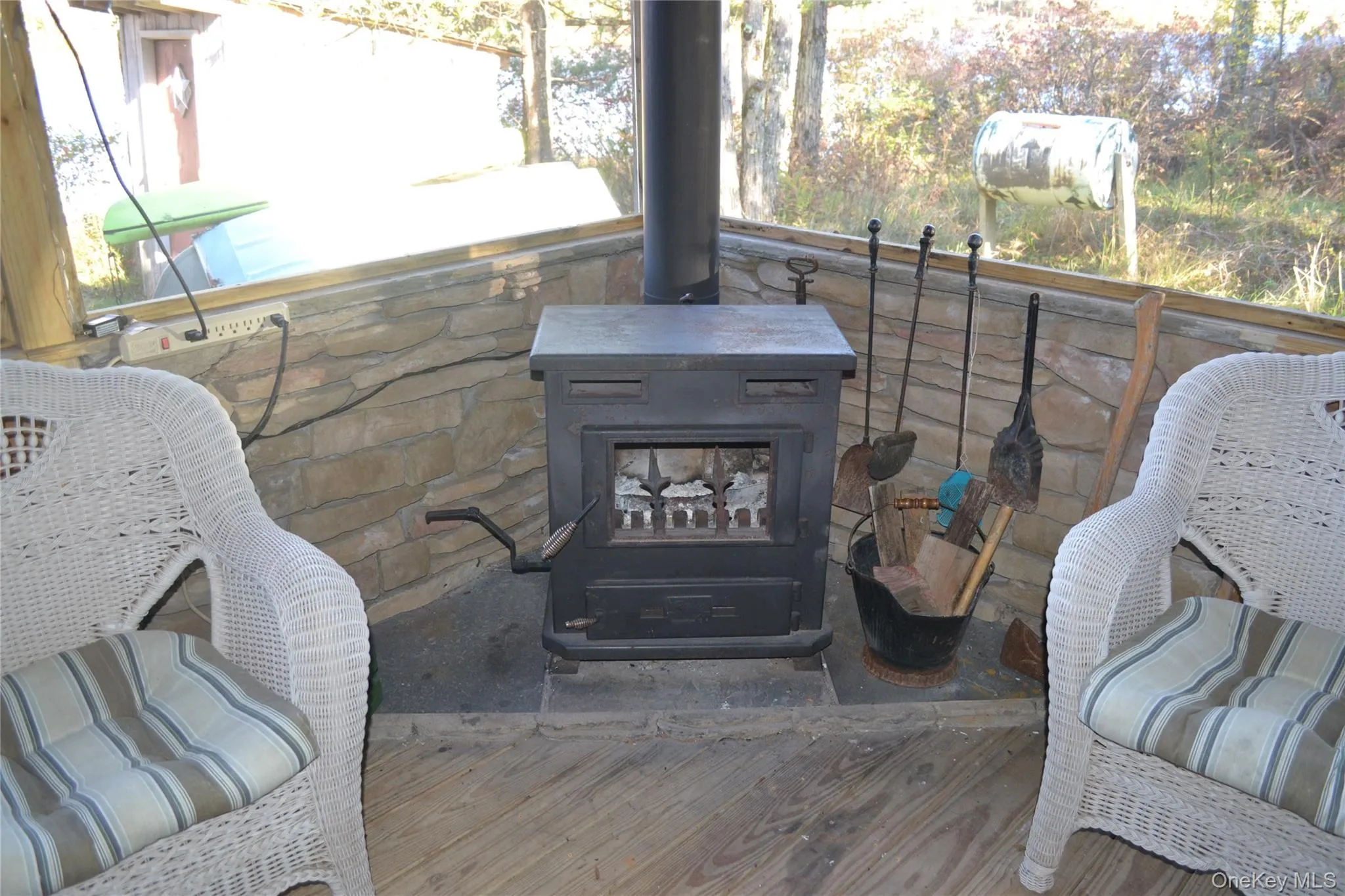 Detailed view of a wood stove on porch Detailed view of a wood stove on porch