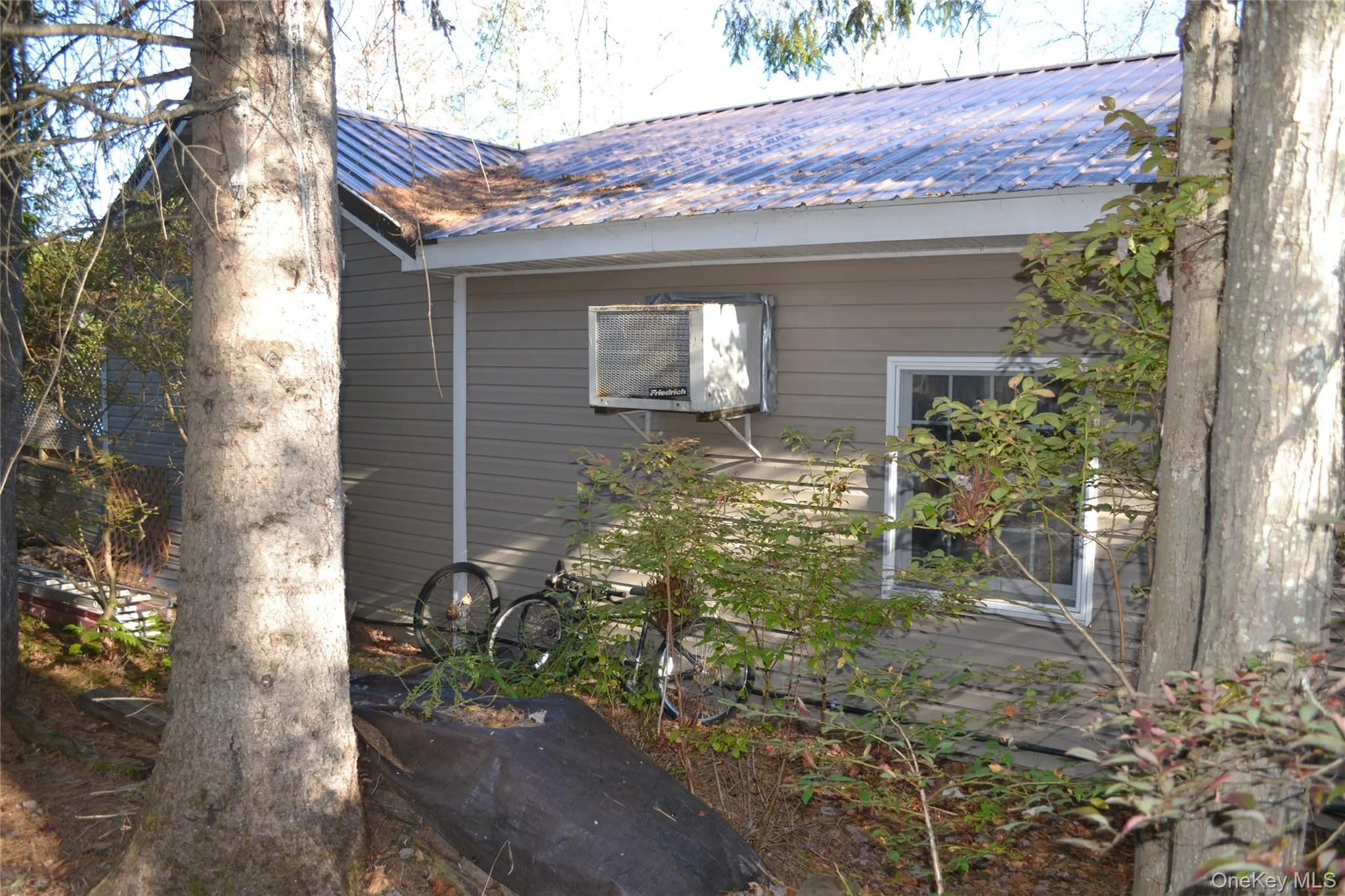 View of side of property with a metal roof View of side of property with a metal roof