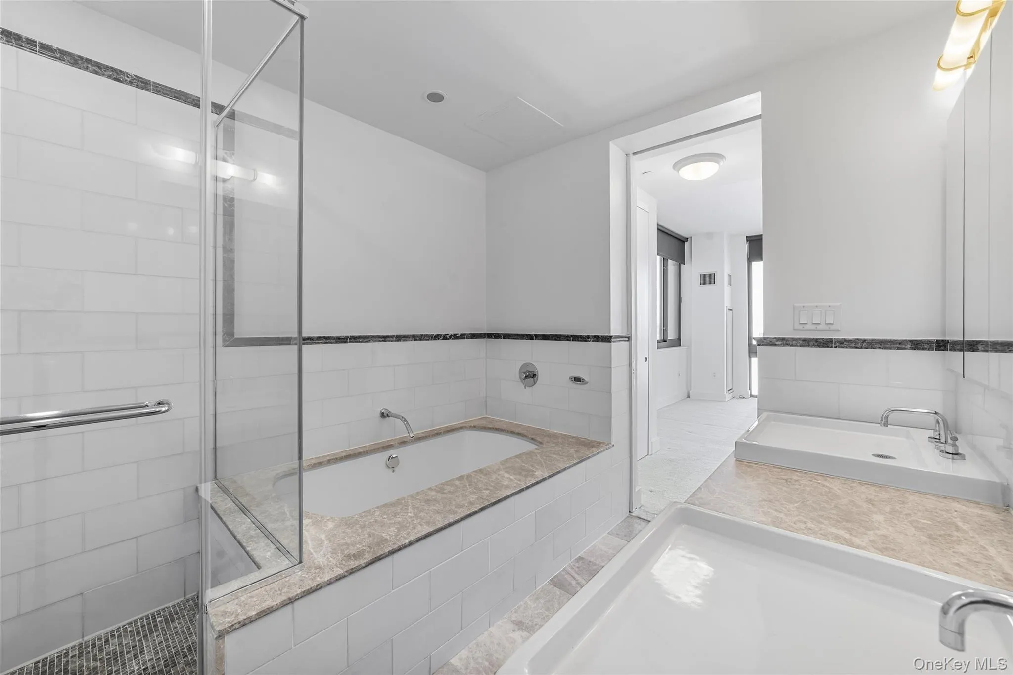 Full bath featuring a bath and a shower stall Full bath featuring a bath and a shower stall