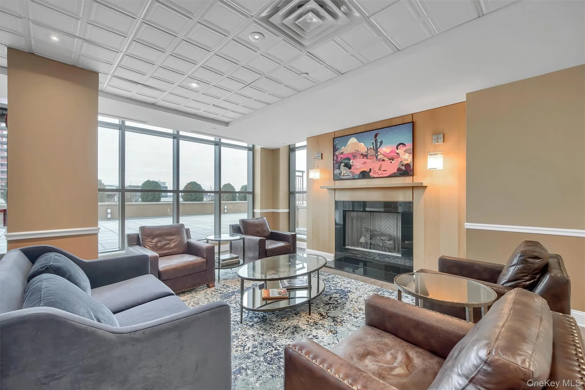 Living room with a fireplace, an ornate ceiling, recessed lighting, and wood finished floors Living room with a fireplace, an ornate ceiling, recessed lighting, and wood finished floors