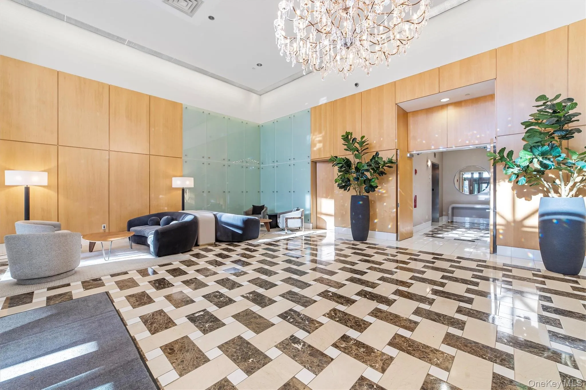 Community lobby with a towering ceiling and wooden walls Community lobby with a towering ceiling and wooden walls