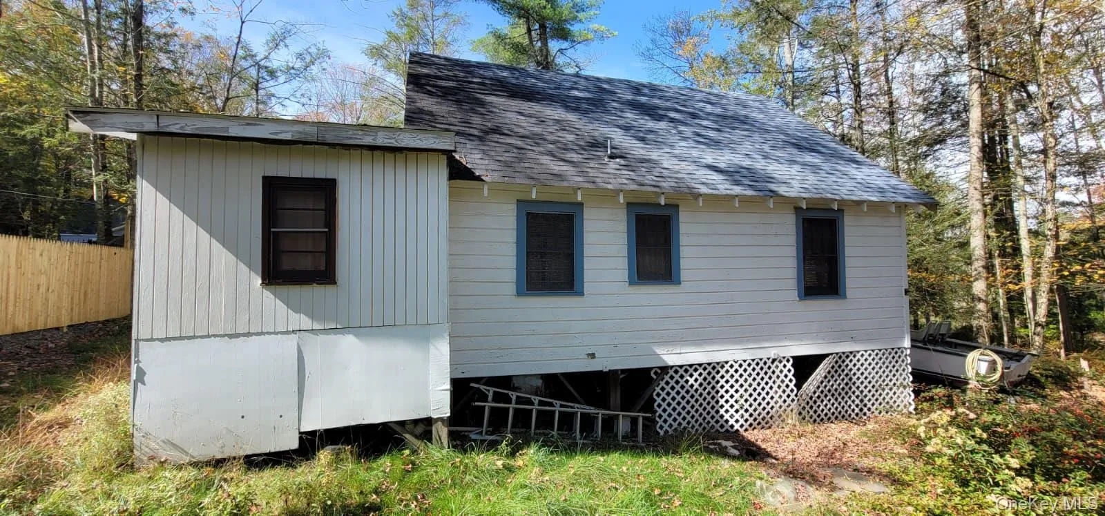 View of side of home featuring roof with shingles View of side of home featuring roof with shingles
