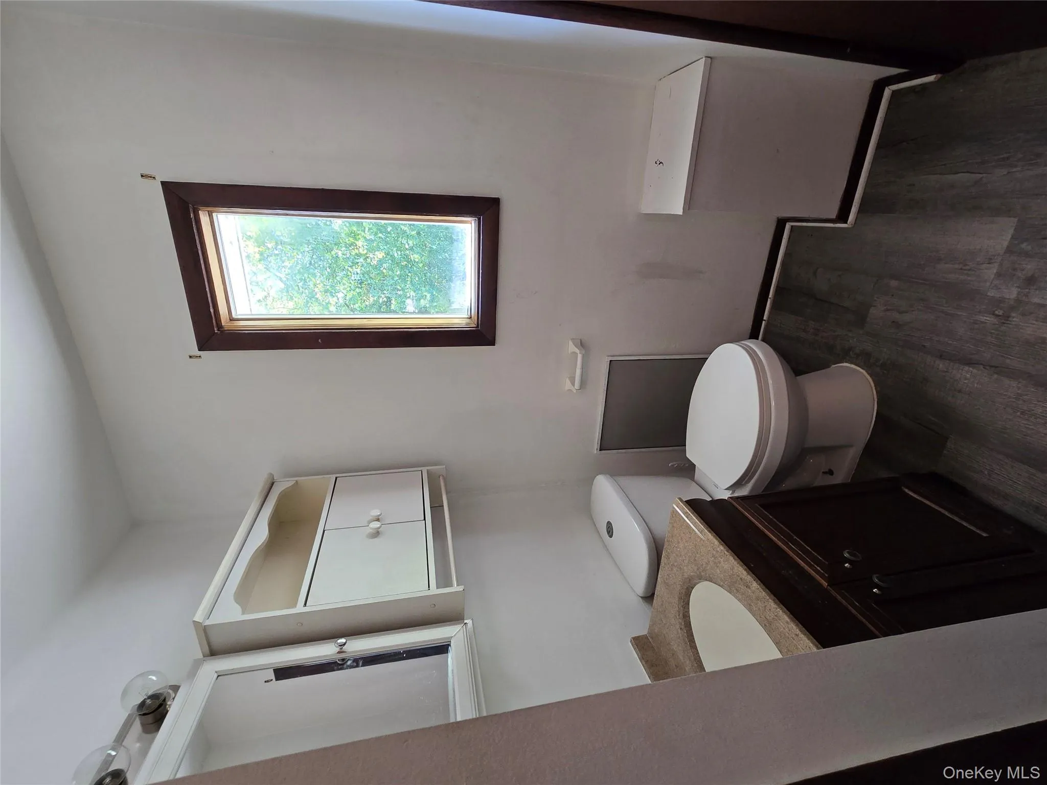Bathroom featuring dark wood finished floors and vanity Bathroom featuring dark wood finished floors and vanity