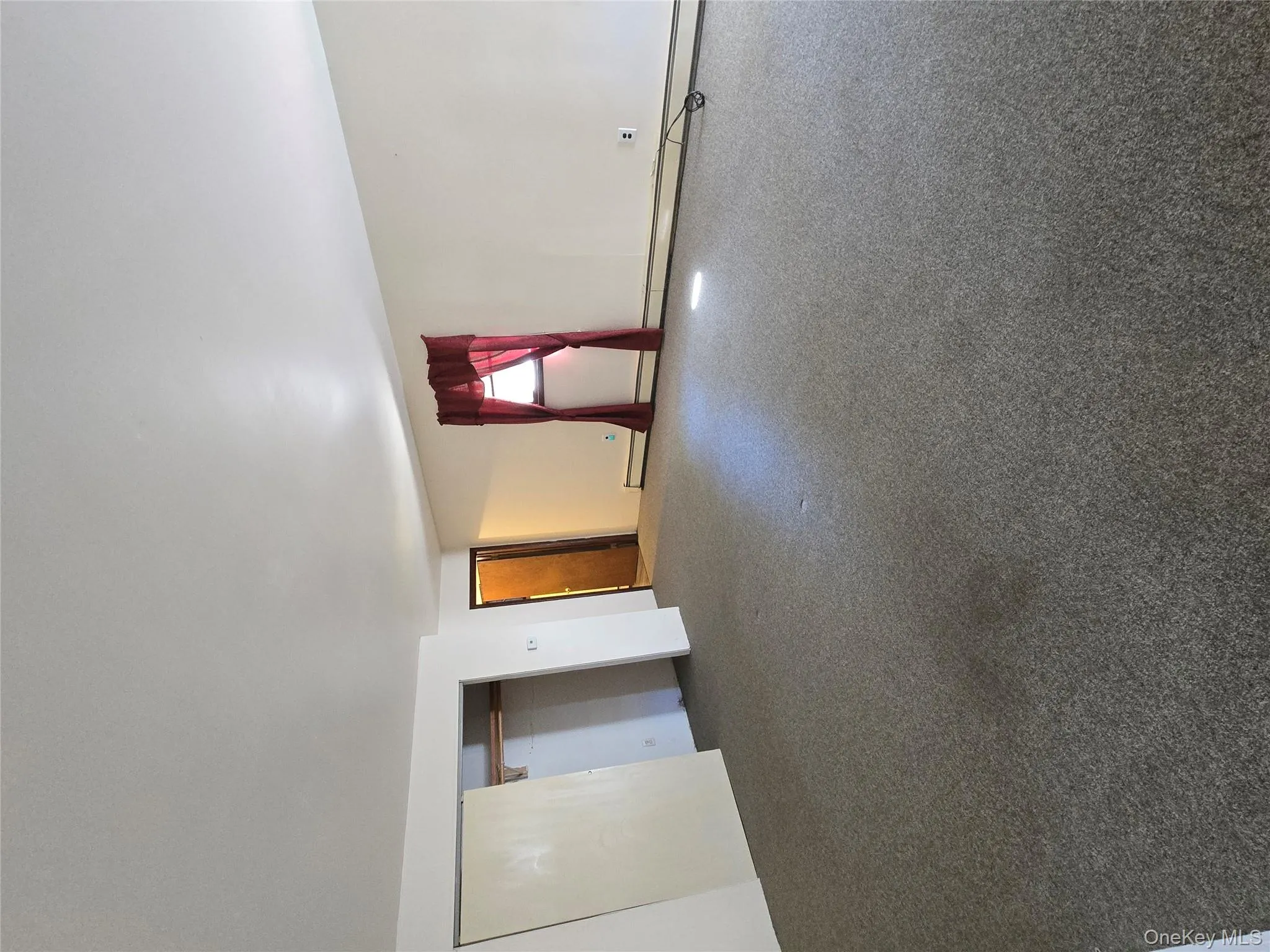 Carpeted spare room featuring a baseboard radiator Carpeted spare room featuring a baseboard radiator