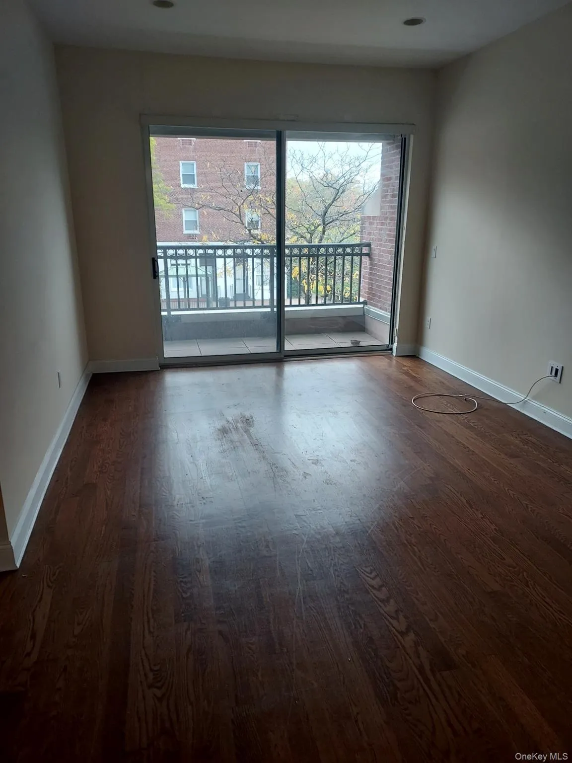 Unfurnished room with dark wood-style floors Unfurnished room with dark wood-style floors