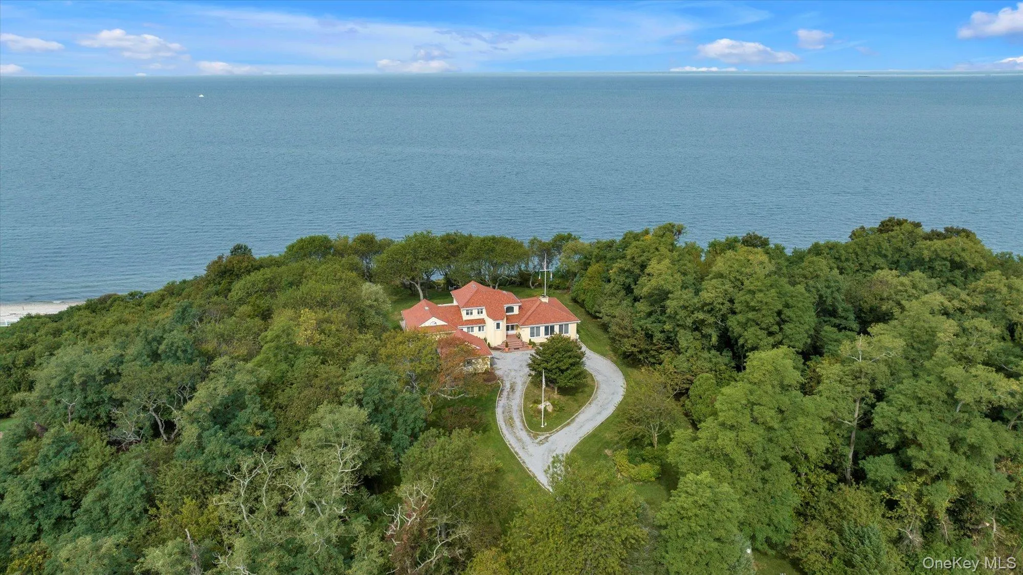 Aerial view of property and surrounding area with a large body of water Aerial view of property and surrounding area with a large body of water