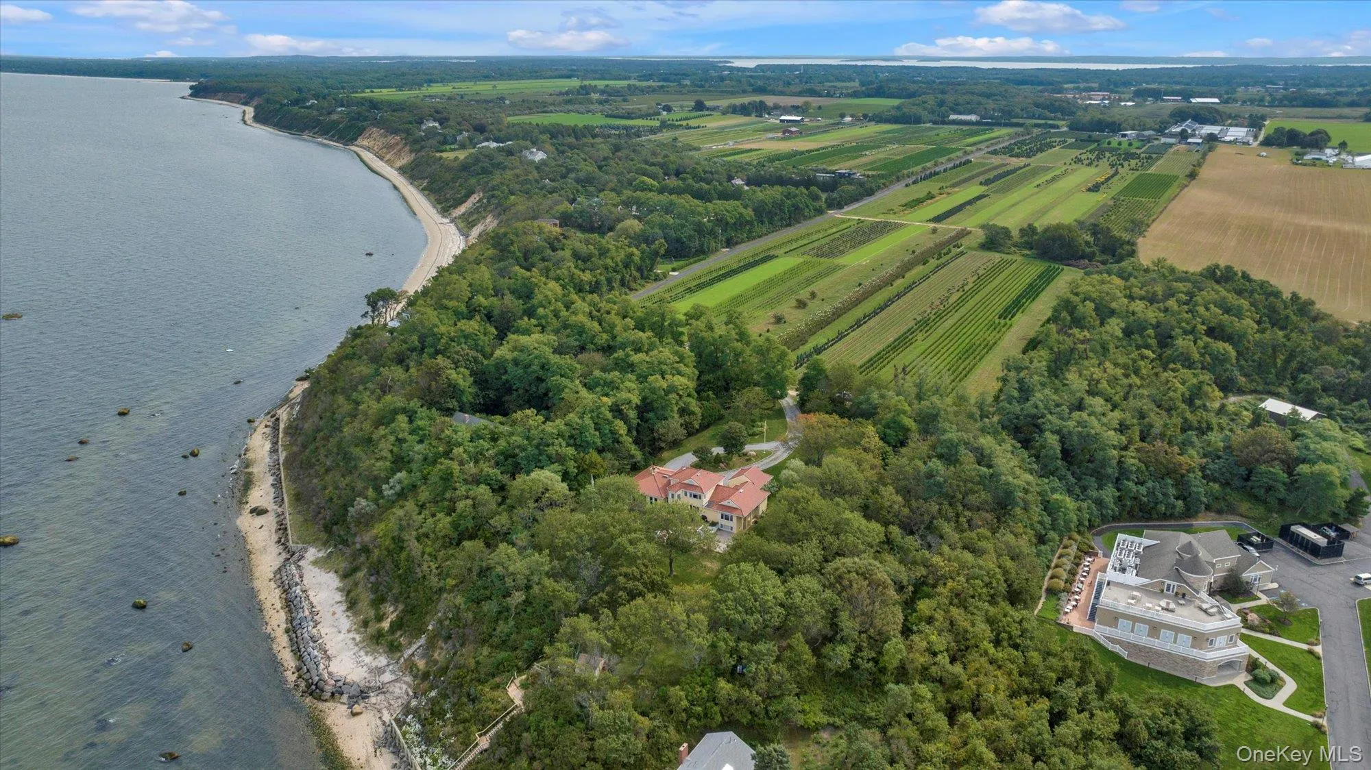 Aerial overview of property's location with a nearby body of water, farmland, and rural landscape Aerial overview of property's location with a nearby body of water, farmland, and rural landscape