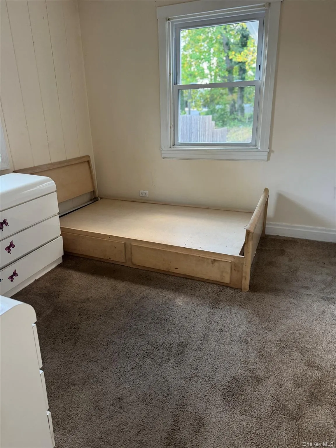 Unfurnished bedroom with carpet flooring Unfurnished bedroom with carpet flooring