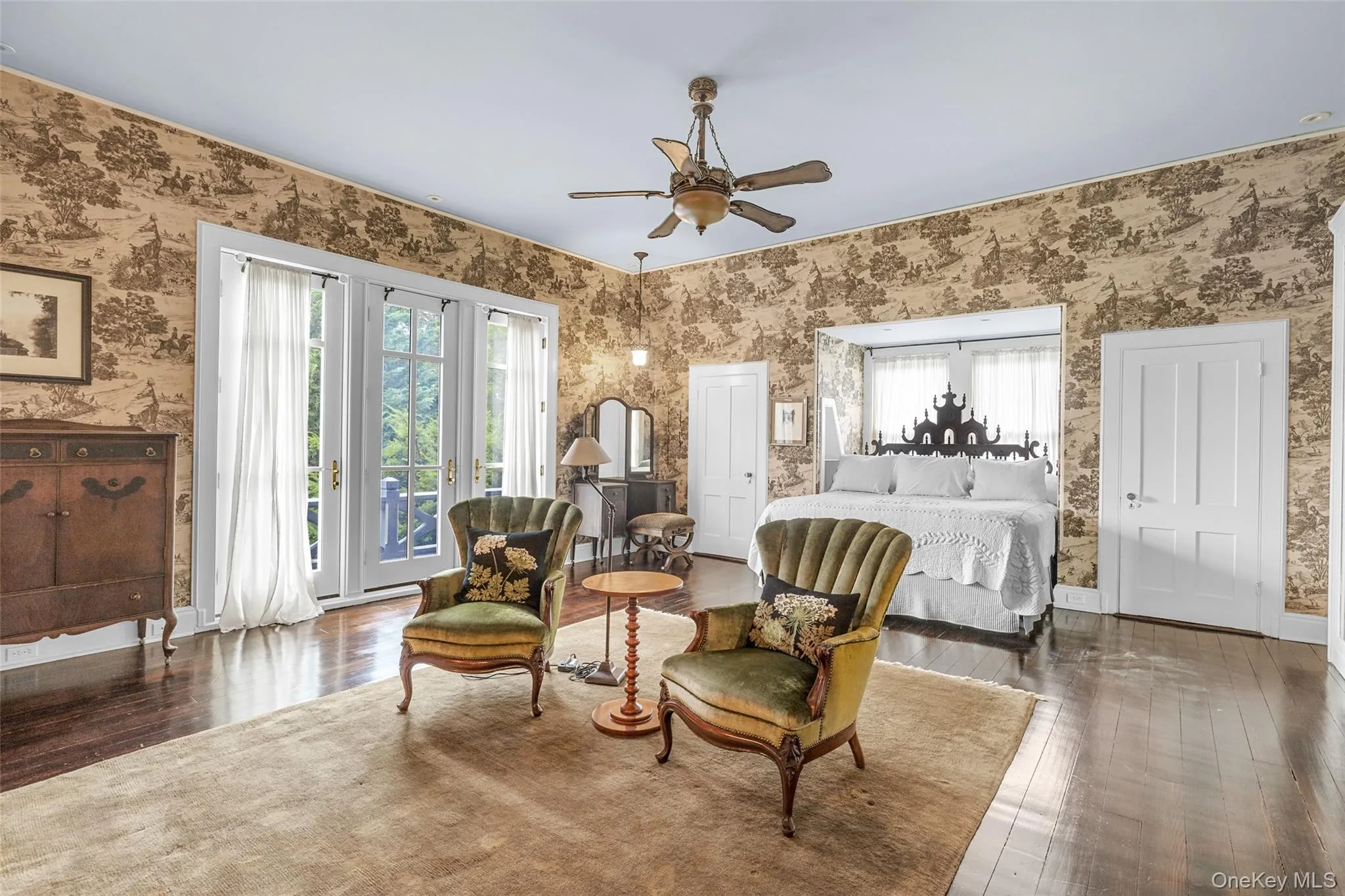 Sun-filled primary suite with ensuite bath and balcony Sun-filled primary suite with ensuite bath and balcony