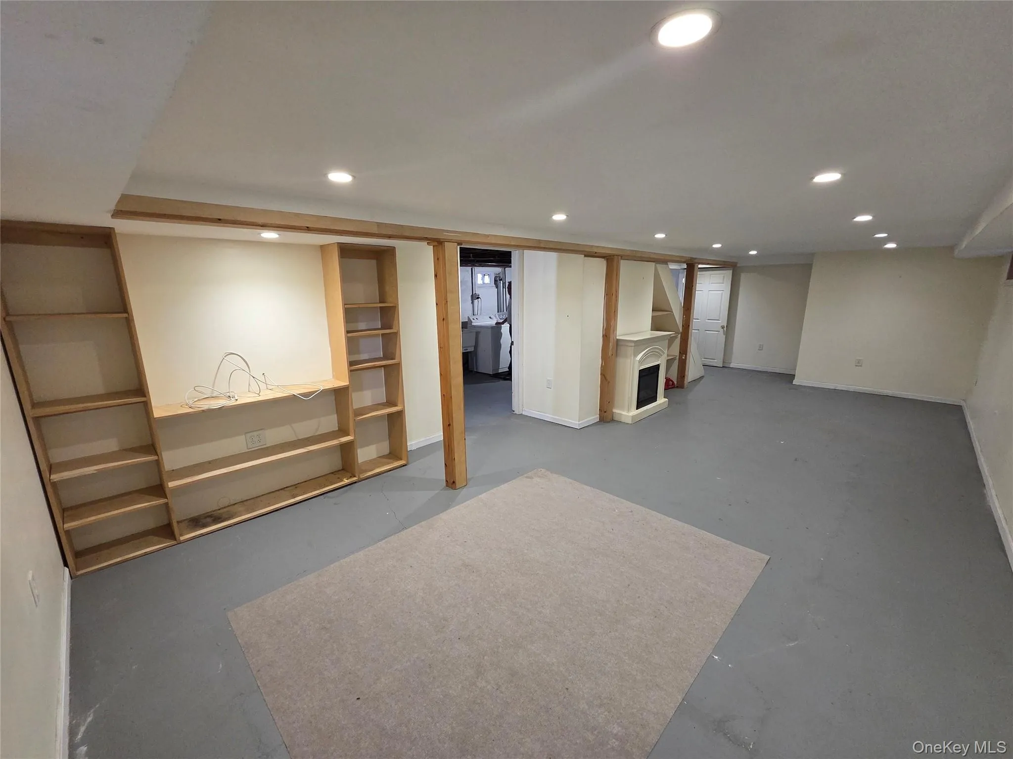 Full finished below grade area with recessed lighting and washer / dryer Full finished below grade area with recessed lighting and washer / dryer