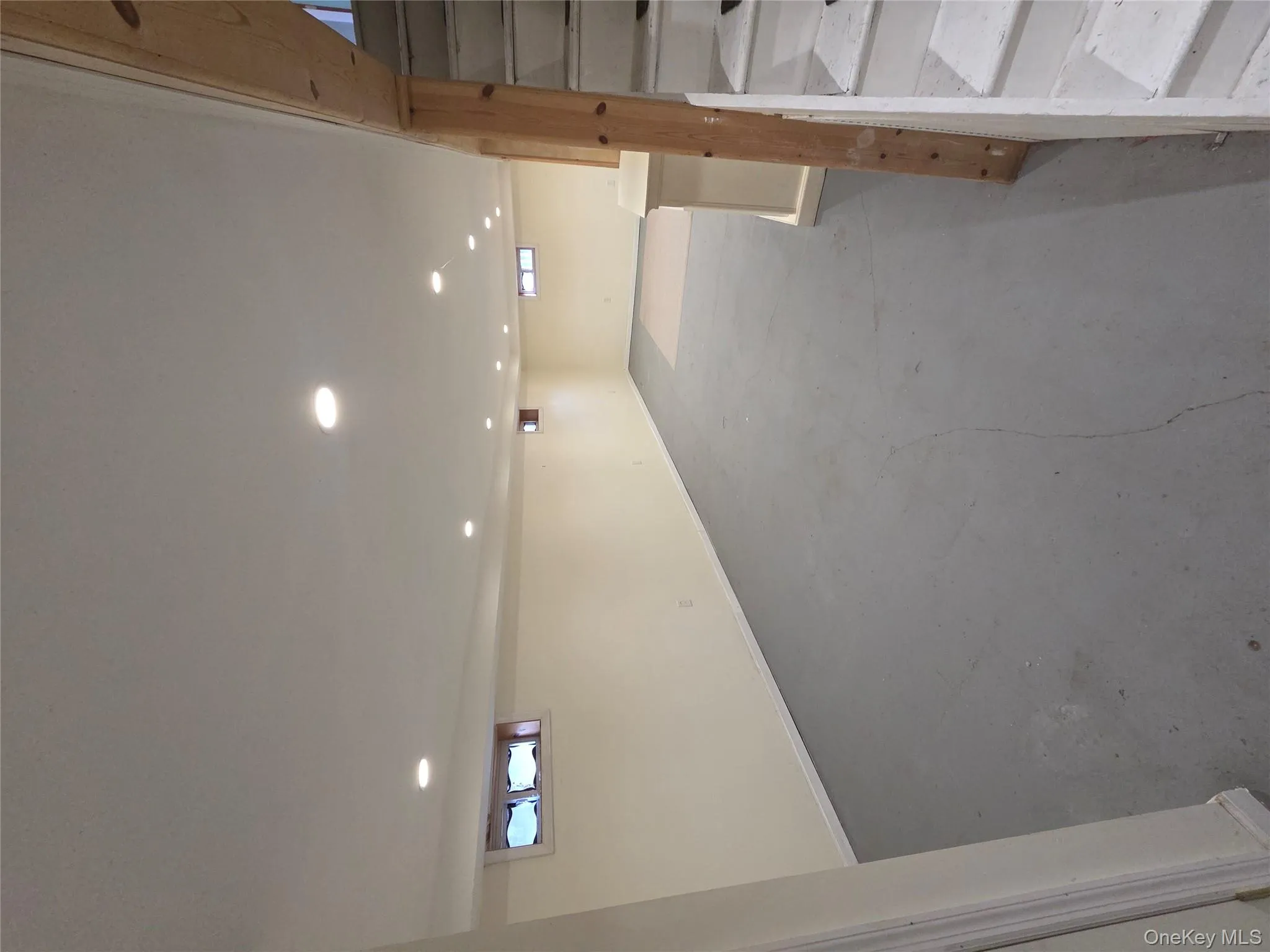 Basement featuring stairs and recessed lighting Basement featuring stairs and recessed lighting