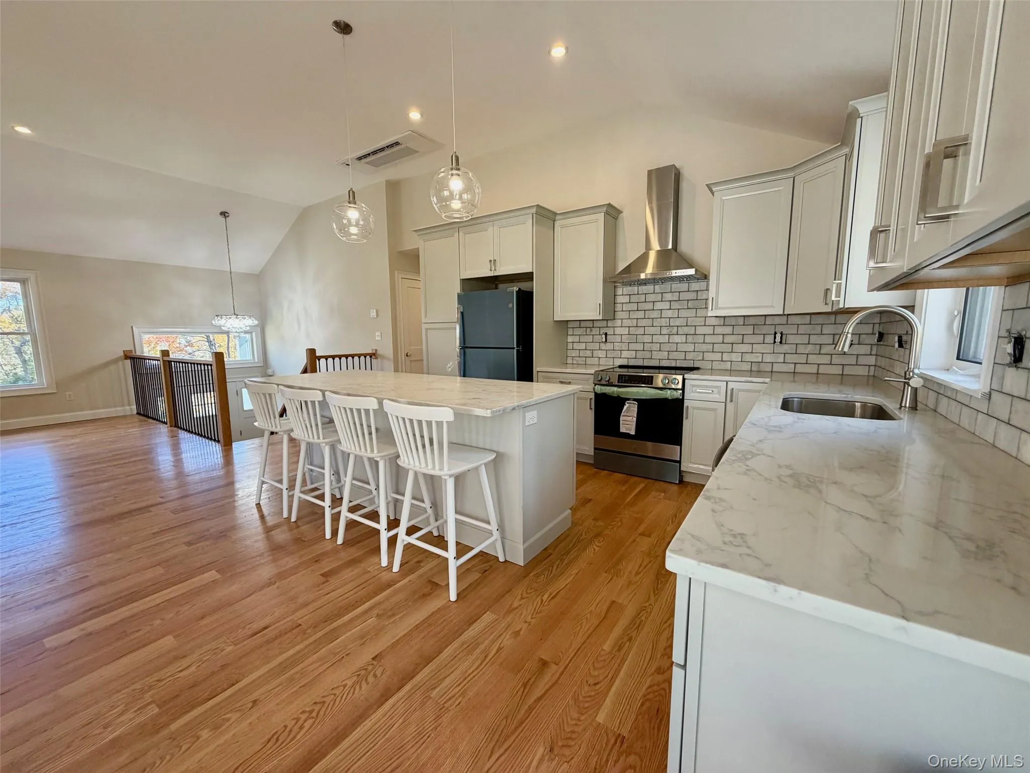 Pendant Lighting over Granite Island and Stainless Steel Appliances Pendant Lighting over Granite Island and Stainless Steel Appliances