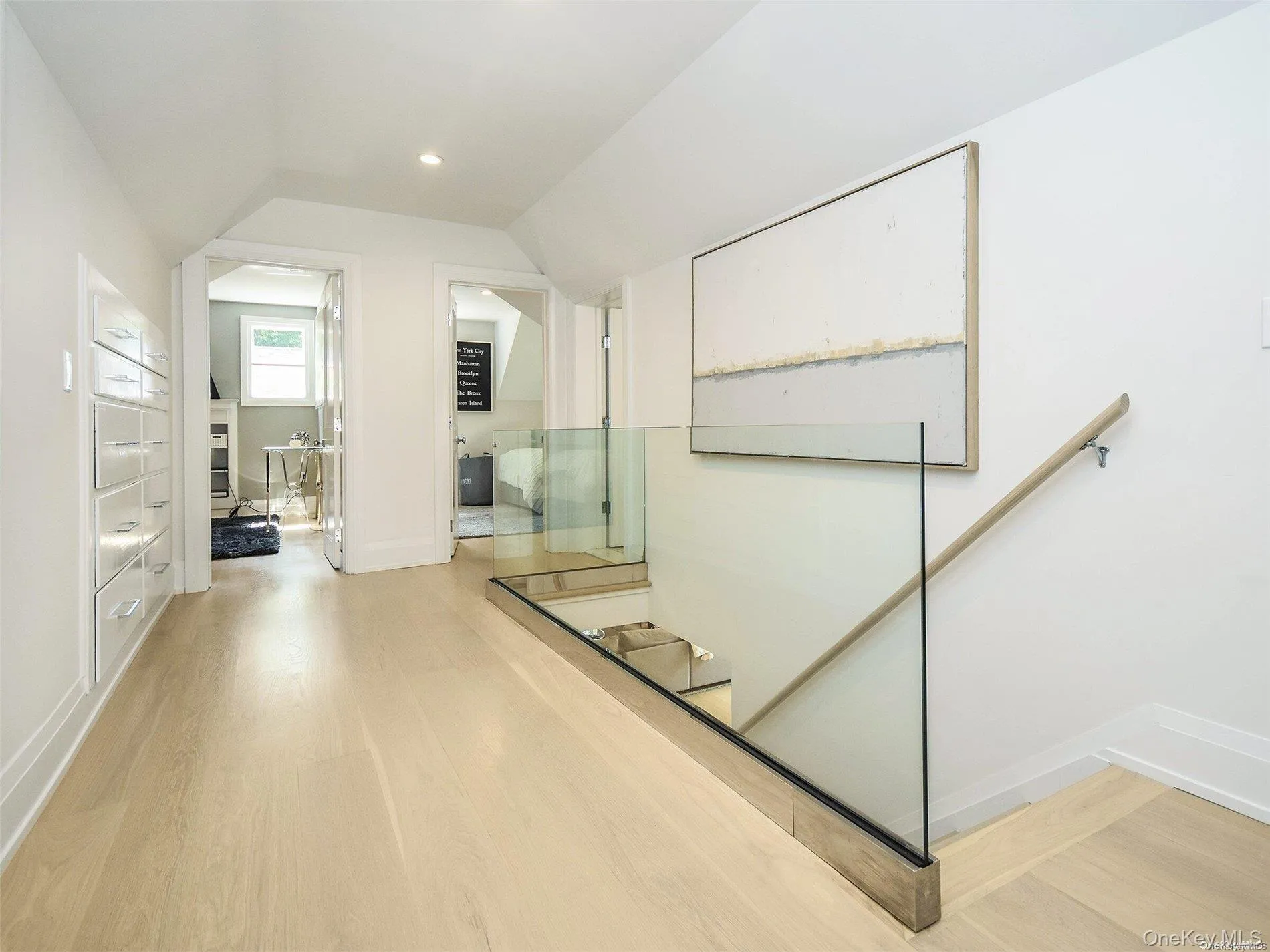 Stairway with wood finished floors and vaulted ceiling Stairway with wood finished floors and vaulted ceiling