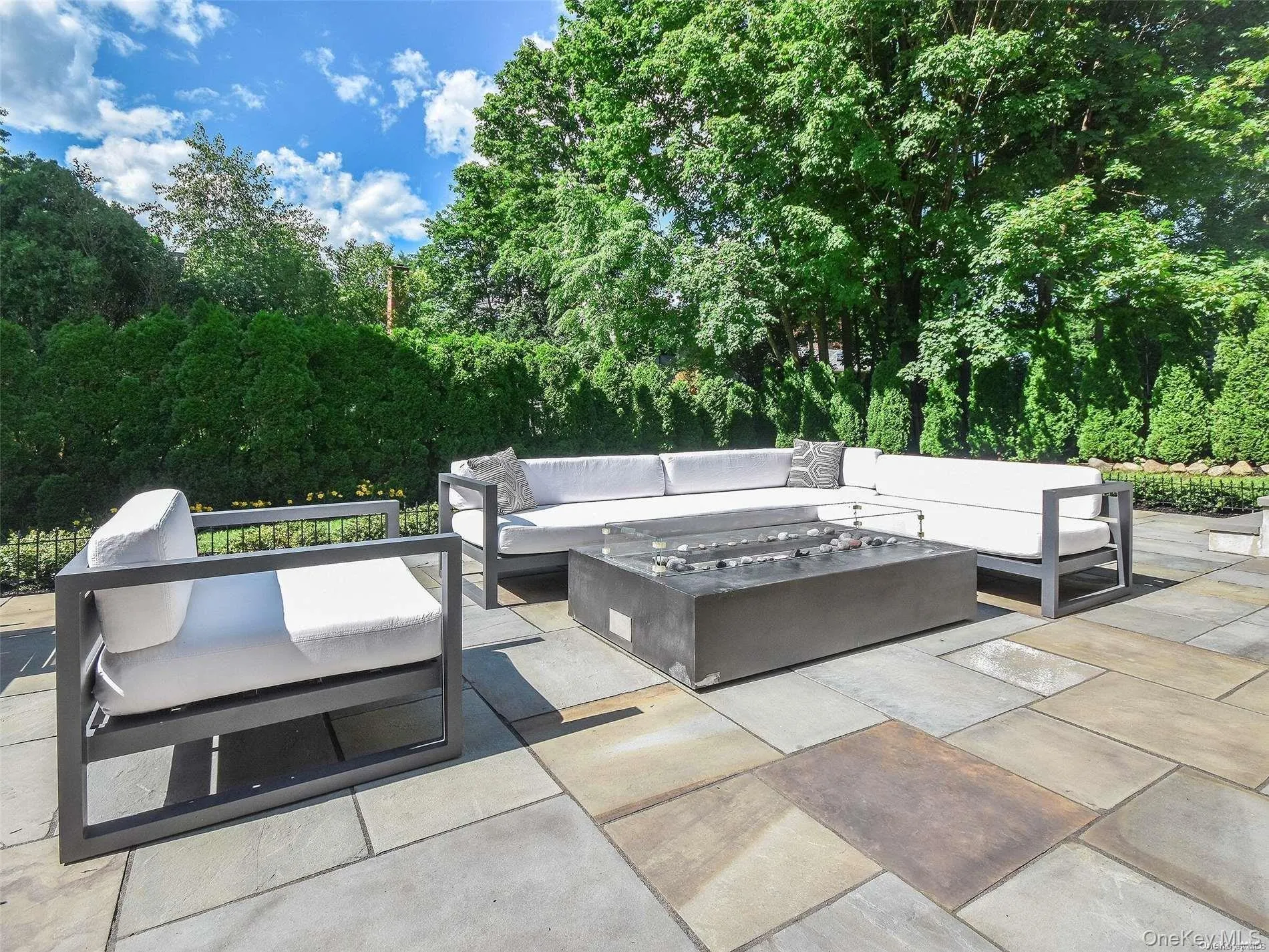 View of patio / terrace featuring an outdoor living space with a fire pit View of patio / terrace featuring an outdoor living space with a fire pit