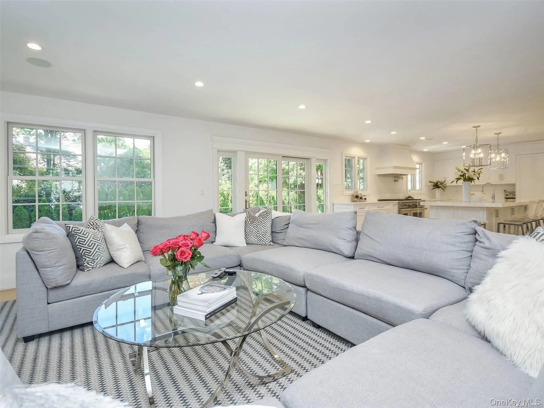 Living area featuring recessed lighting and a chandelier Living area featuring recessed lighting and a chandelier