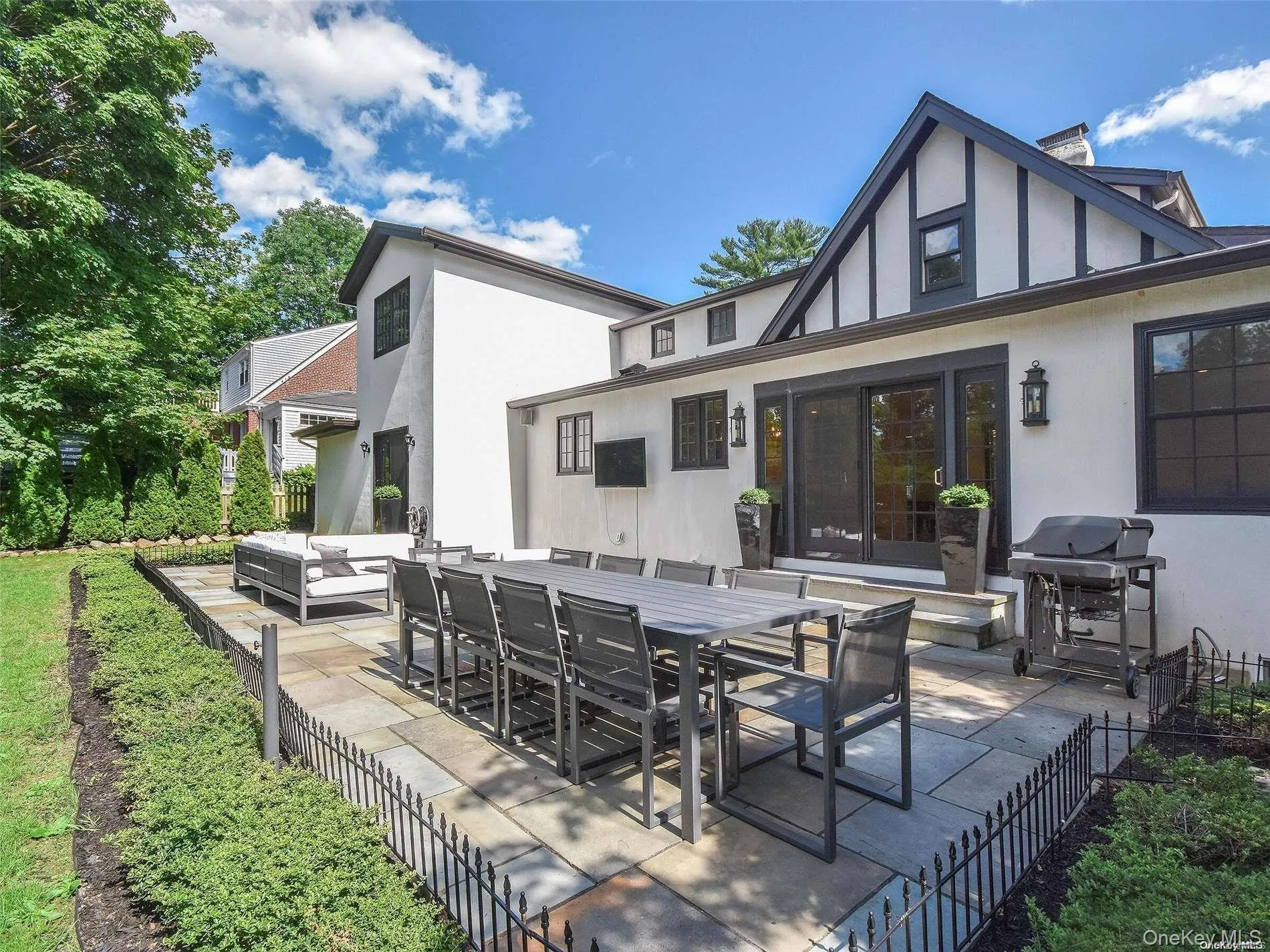 View of patio featuring an outdoor living space, a grill, and outdoor dining space View of patio featuring an outdoor living space, a grill, and outdoor dining space