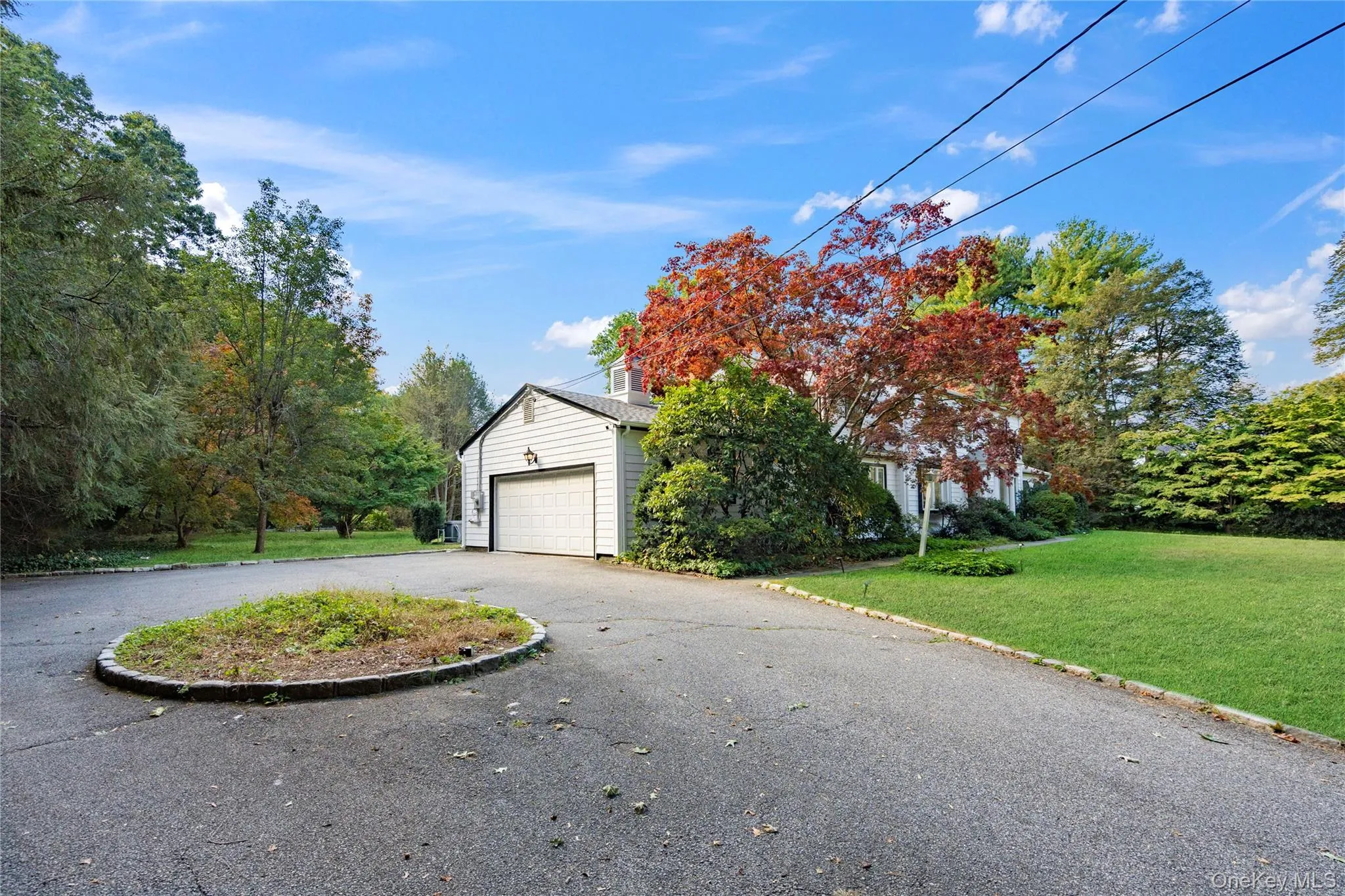 Spacious driveway and attached garage Spacious driveway and attached garage