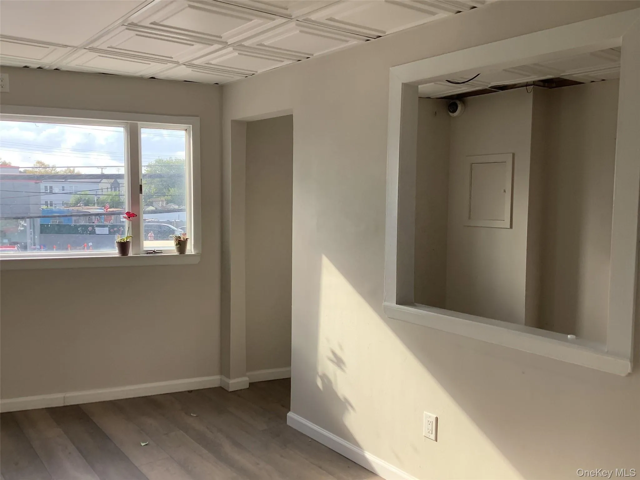 Spare room with an ornate ceiling and wood finished floors Spare room with an ornate ceiling and wood finished floors