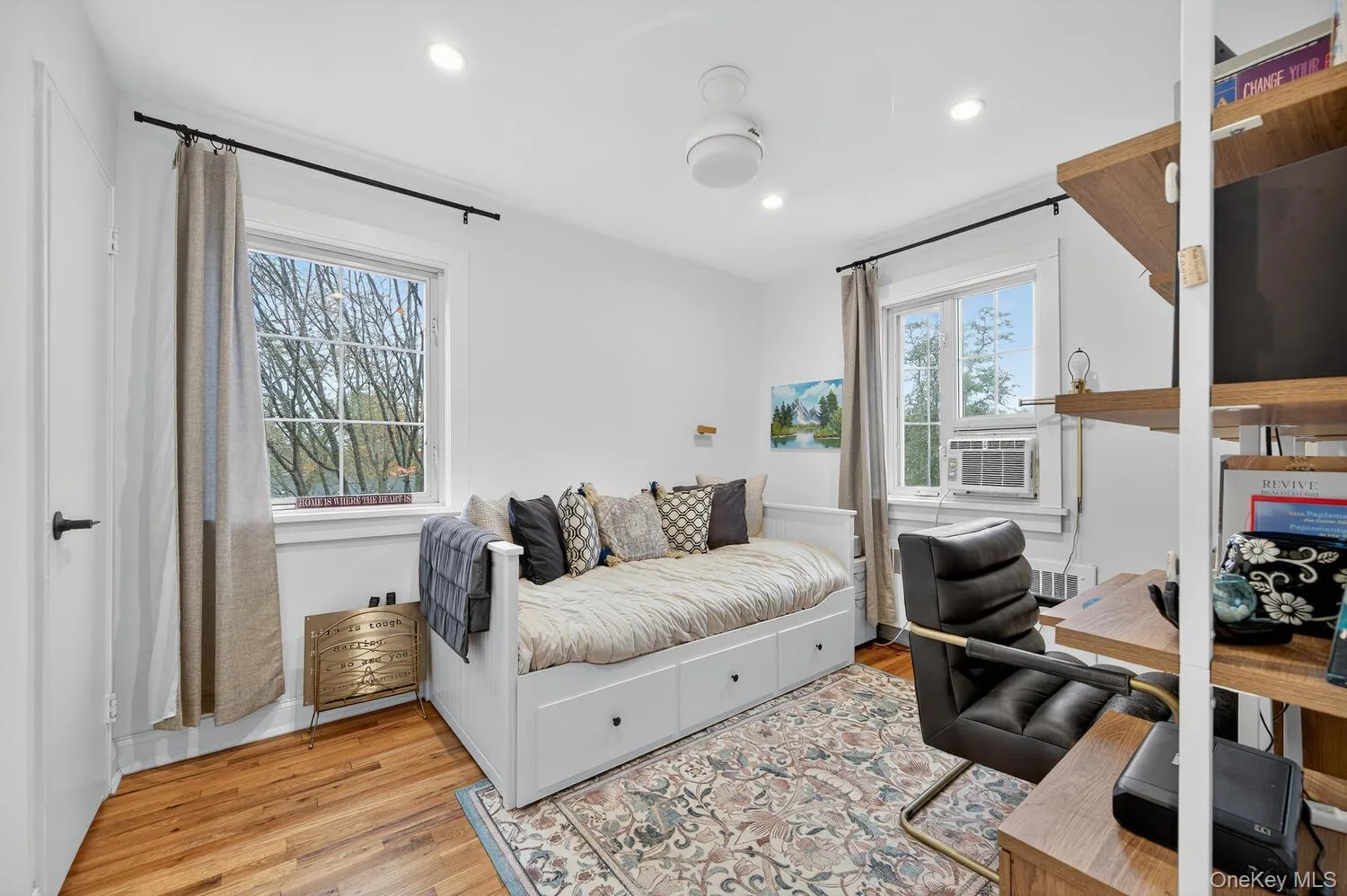 bedroom or office featuring light wood-style flooring and recessed lighting bedroom or office featuring light wood-style flooring and recessed lighting