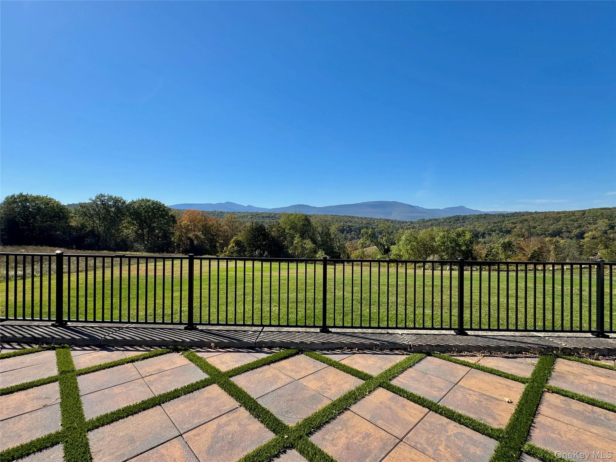 View of patio with a mountain view and a wooded view View of patio with a mountain view and a wooded view
