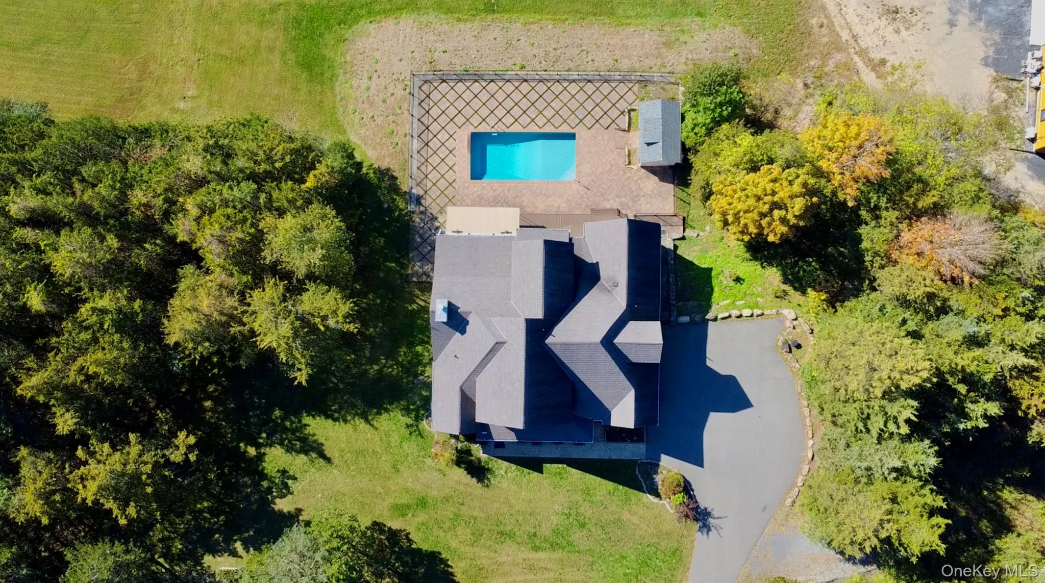 View of subject property featuring a pool View of subject property featuring a pool