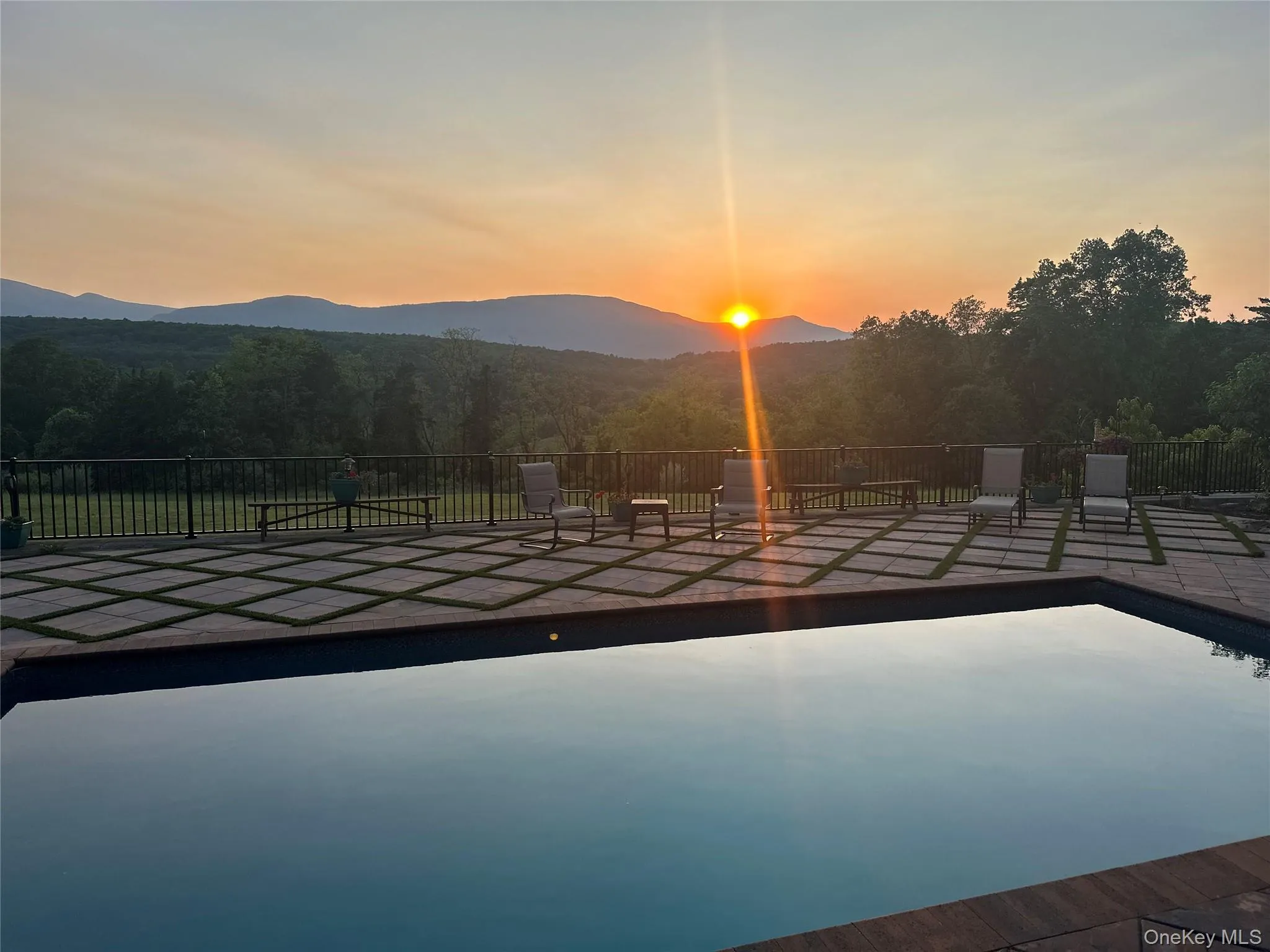 View of swimming pool with a forest view and a mountain view View of swimming pool with a forest view and a mountain view