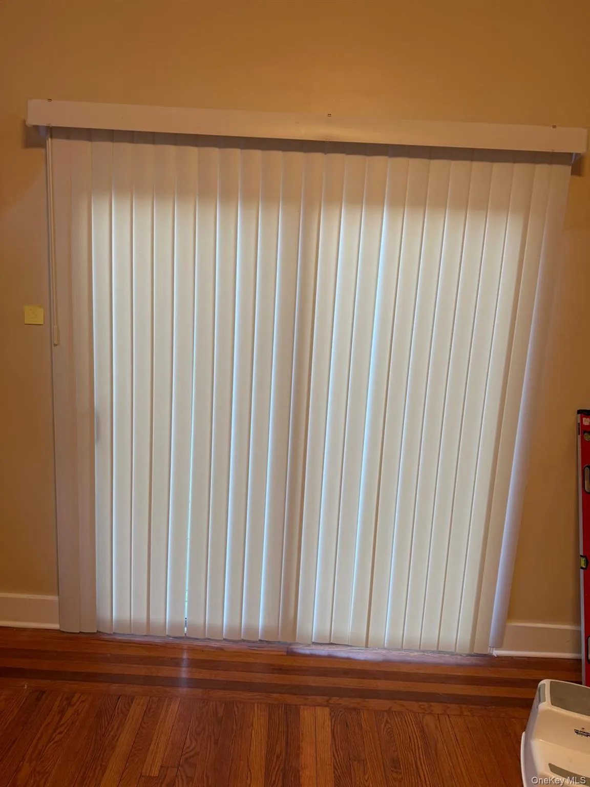 Detailed view of baseboards and wood finished floors Detailed view of baseboards and wood finished floors